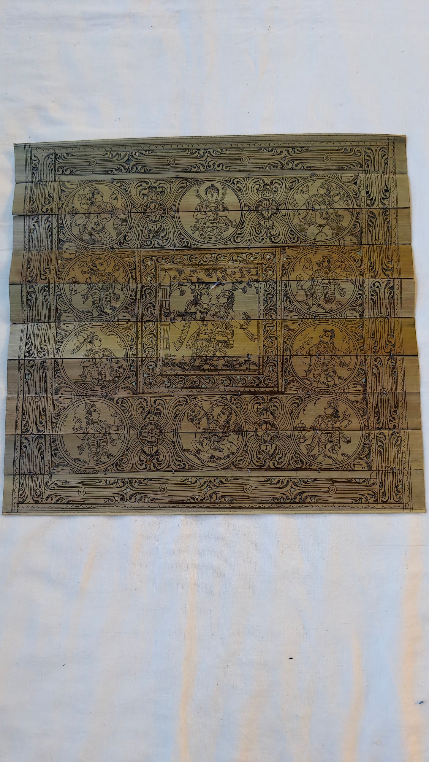 Patachitra hand-painted dasavatar with Radha Krishna in centre on palm leaves