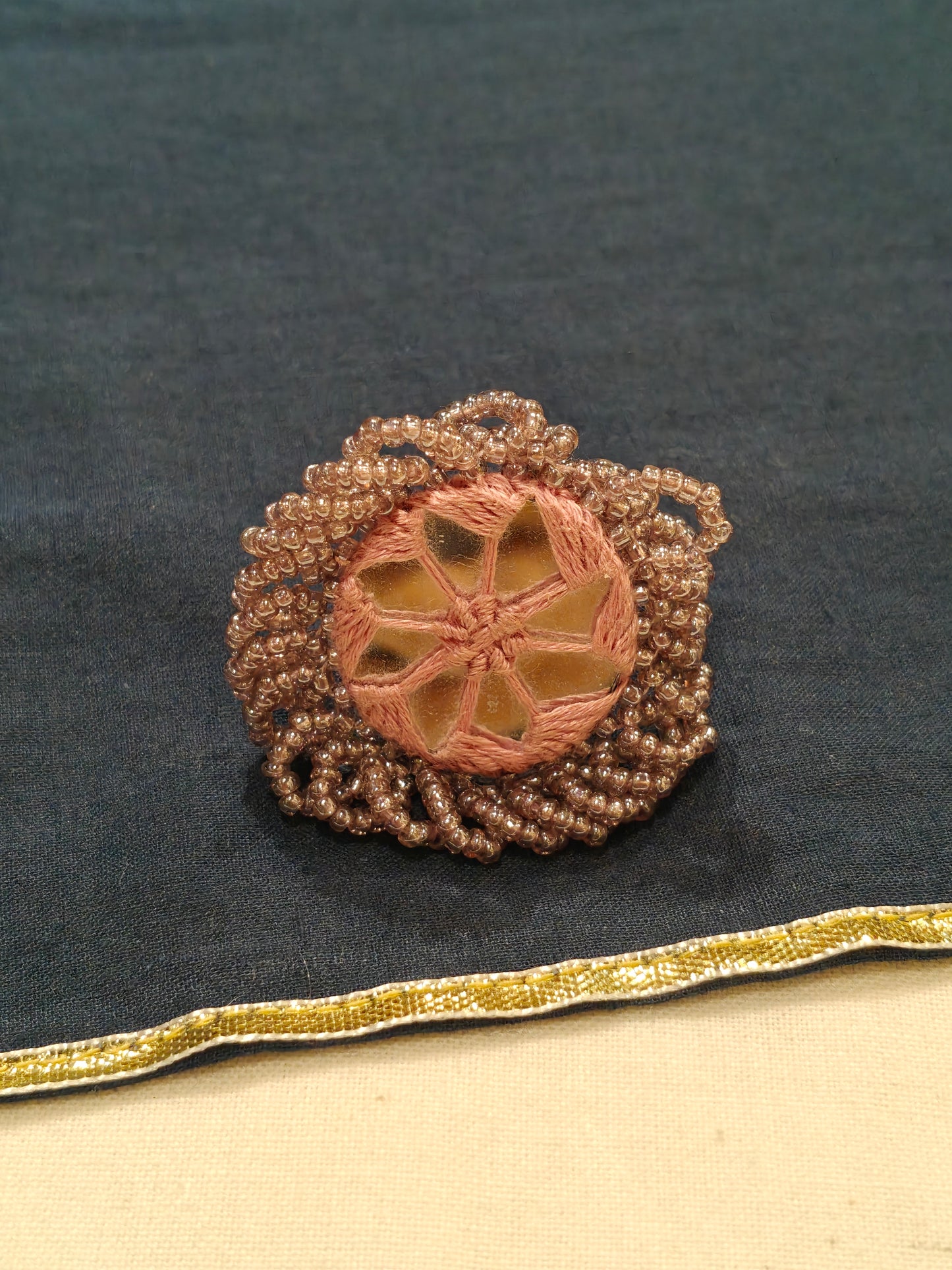 Handcrafted finger ring with bead work and mirror