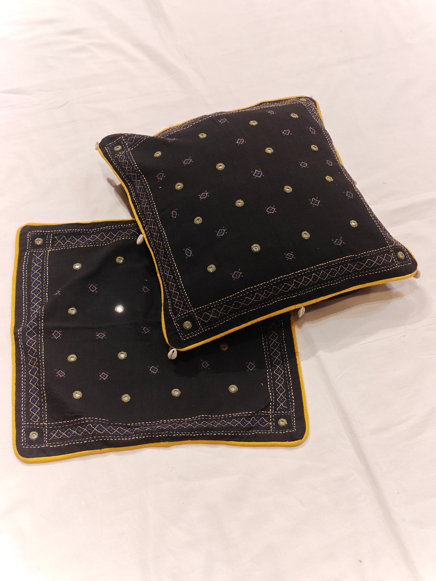 Black cushion cover with mirror hand embroidery and shells