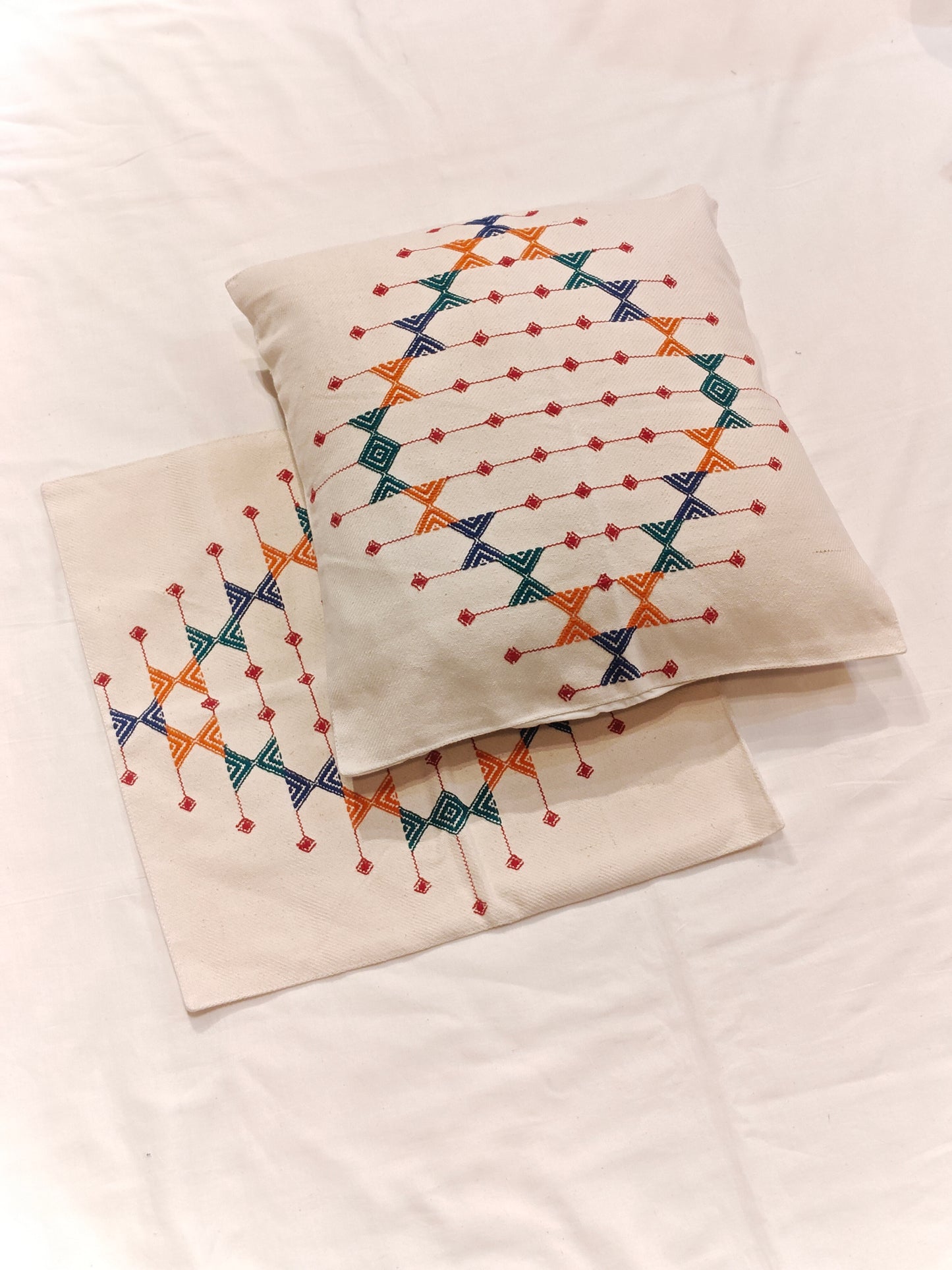Off-white cotton cushion covers with pattu handwoven design