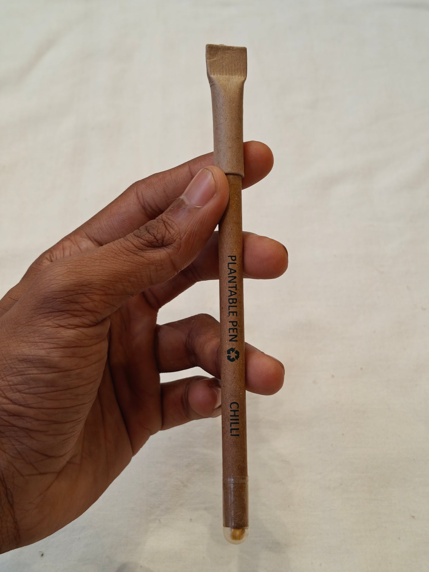 Handcrafted plantable pen with seeds at the bottom