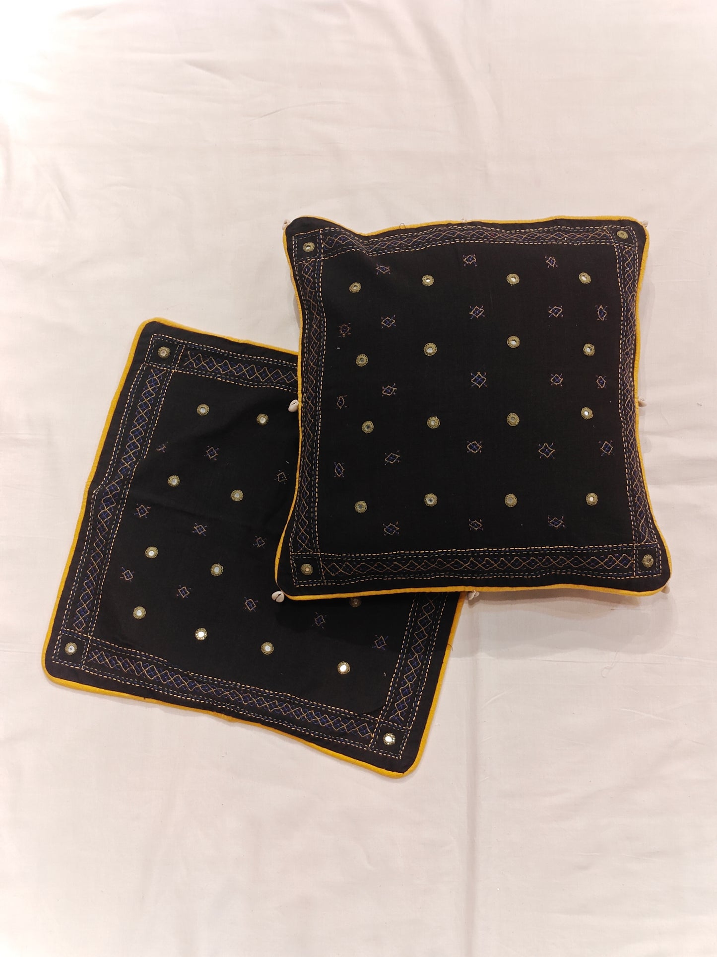 Black cushion cover with mirror hand embroidery and shells