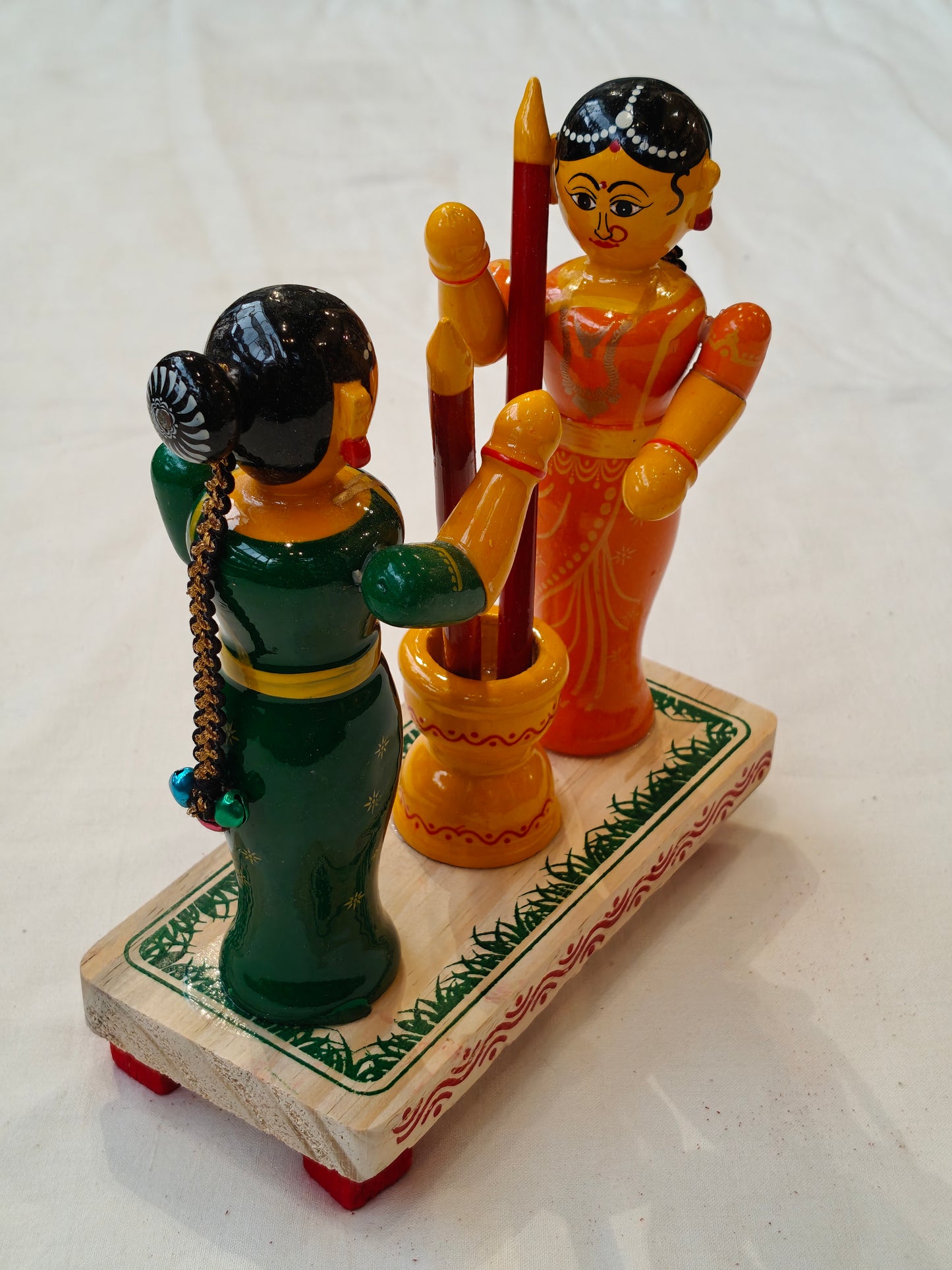 Two women pounding - handcrafted wooden decor