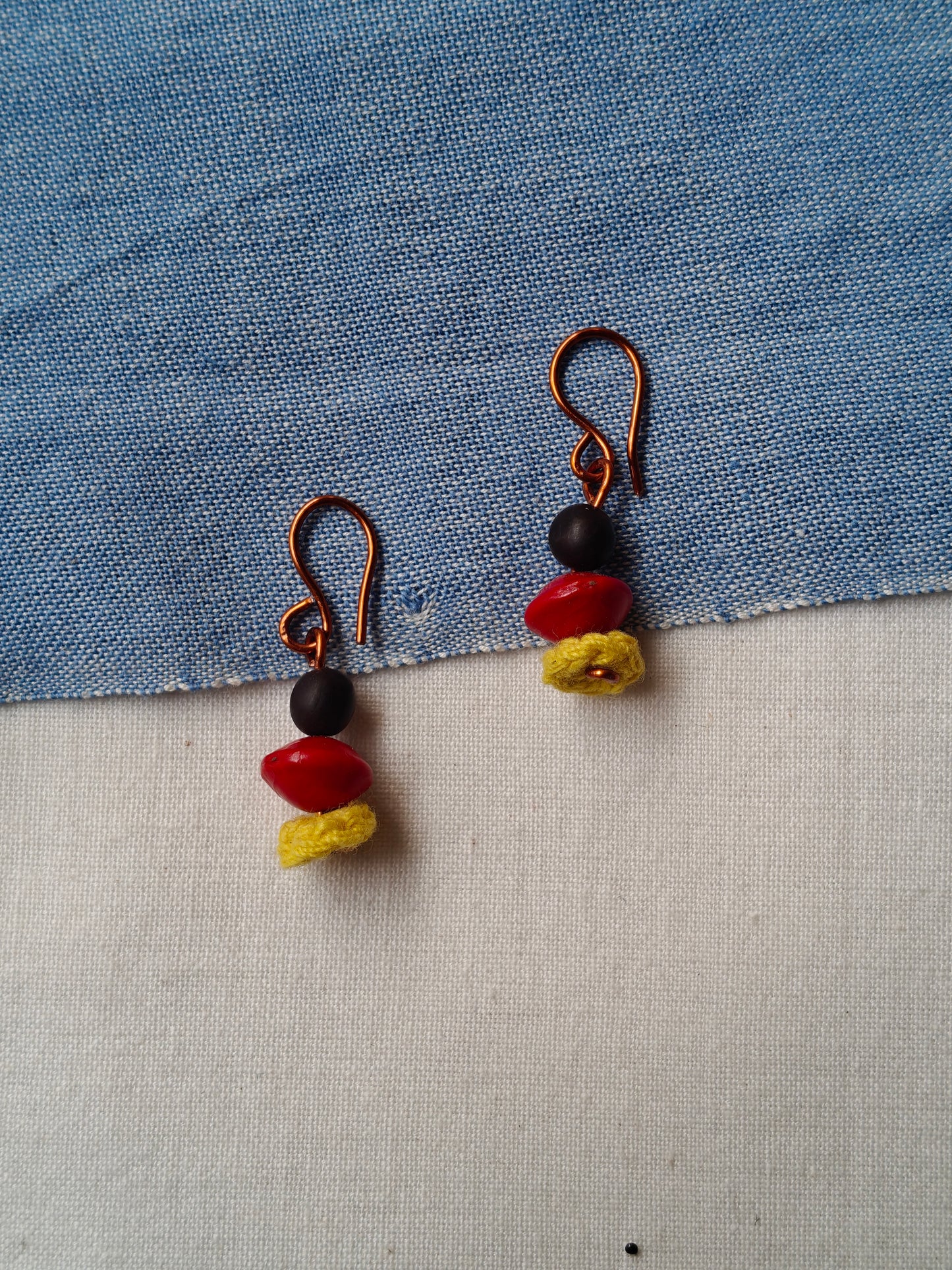 Handcrafted earrings with seeds and crochet flowers