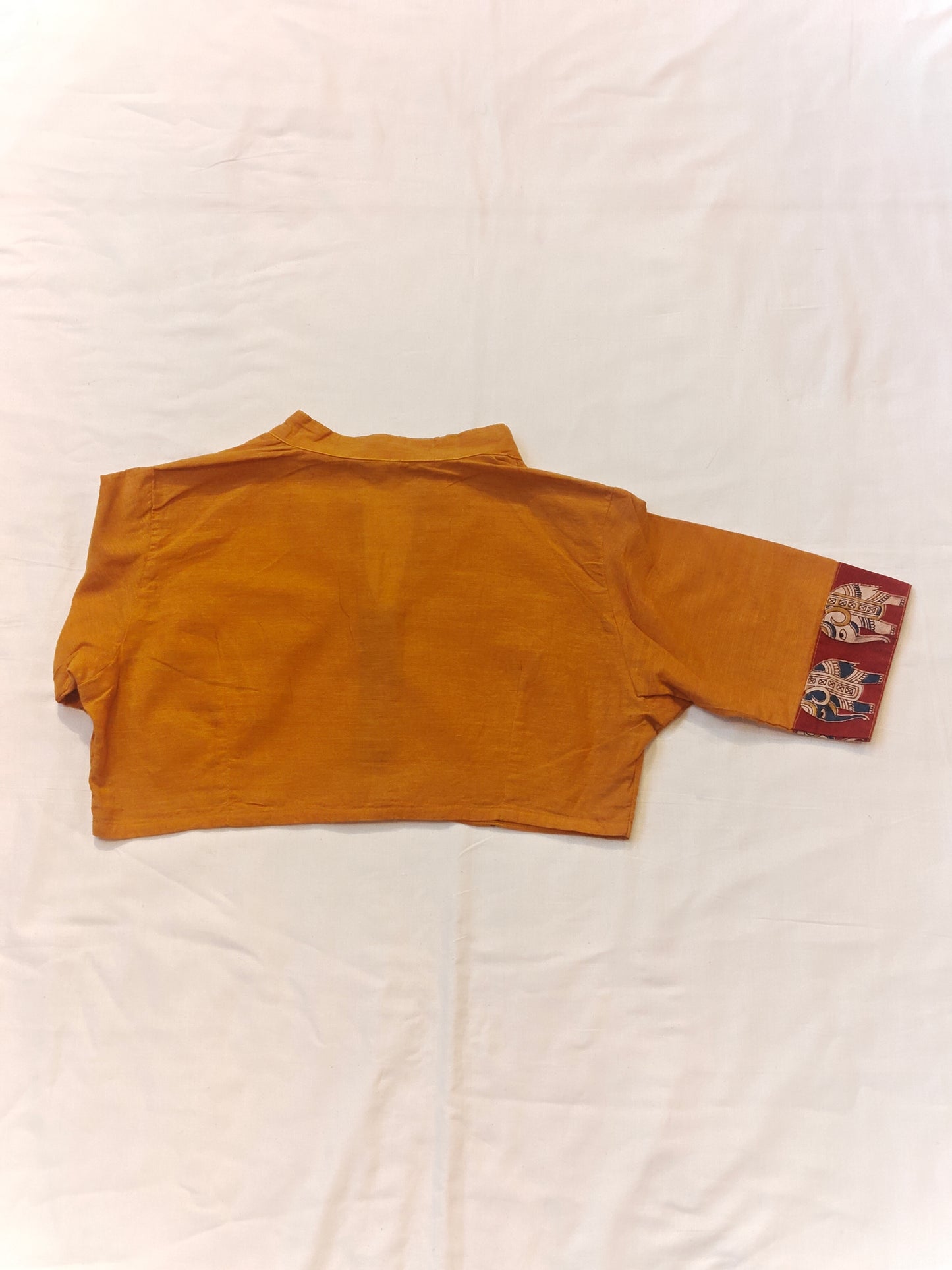 Orange collared cotton short blouse with elephant motif borders