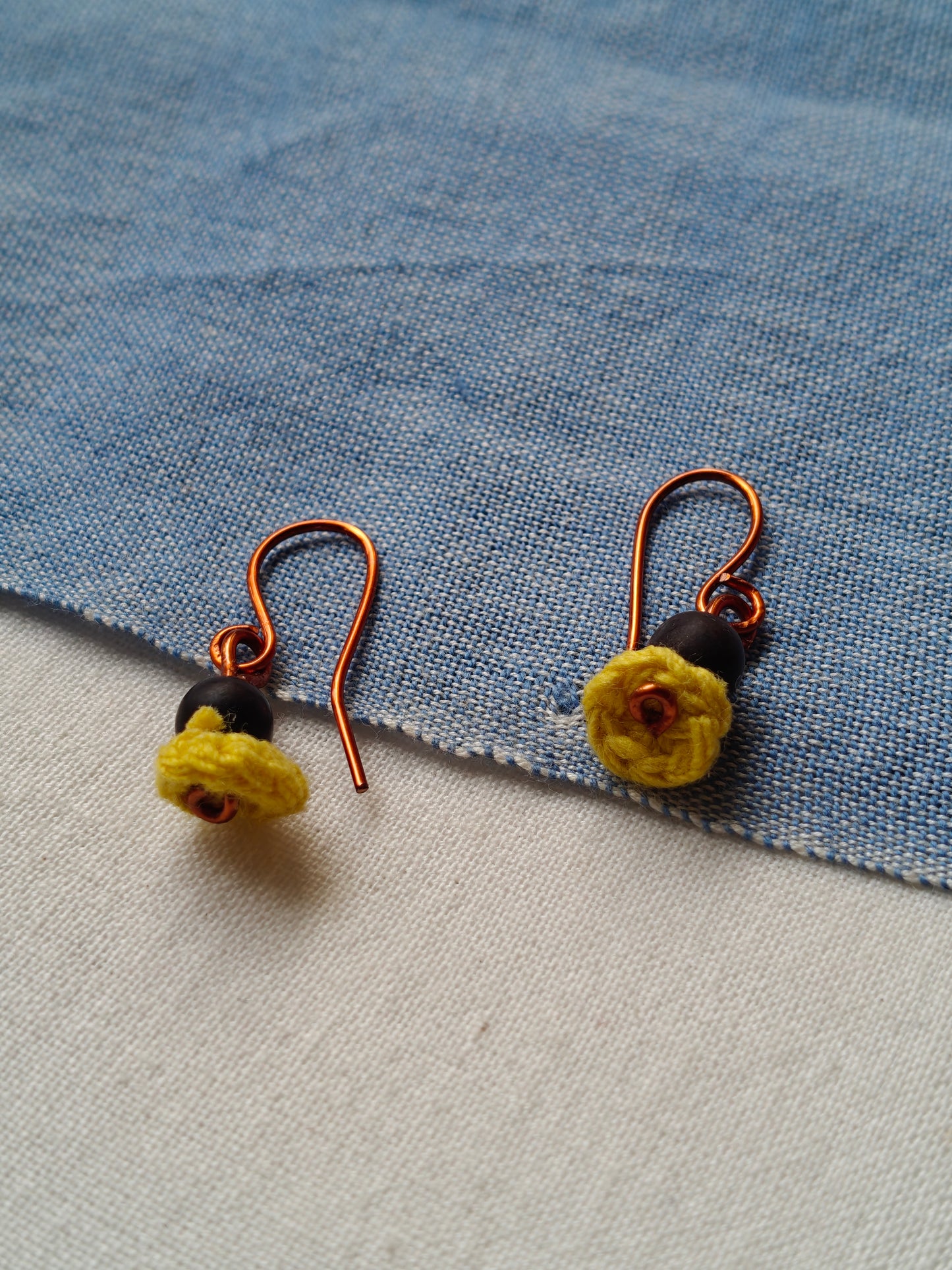 Handcrafted earrings with seeds and crochet flowers