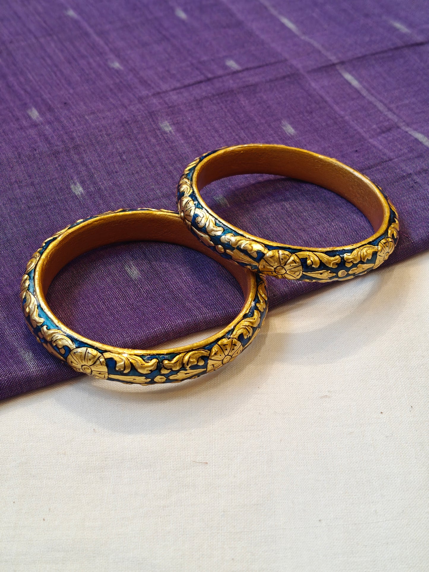 Blue gold leaf embossed pair of bangles with floral design - set of 2