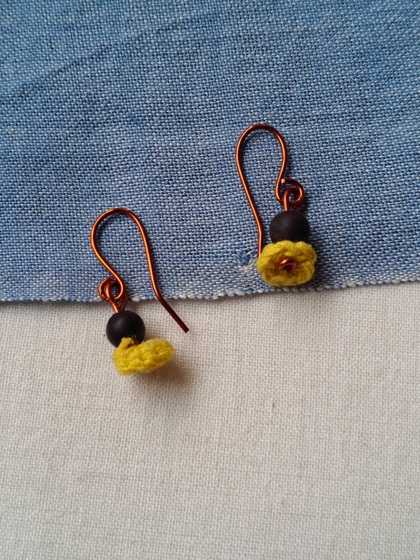 Handcrafted earrings with seeds and crochet flowers