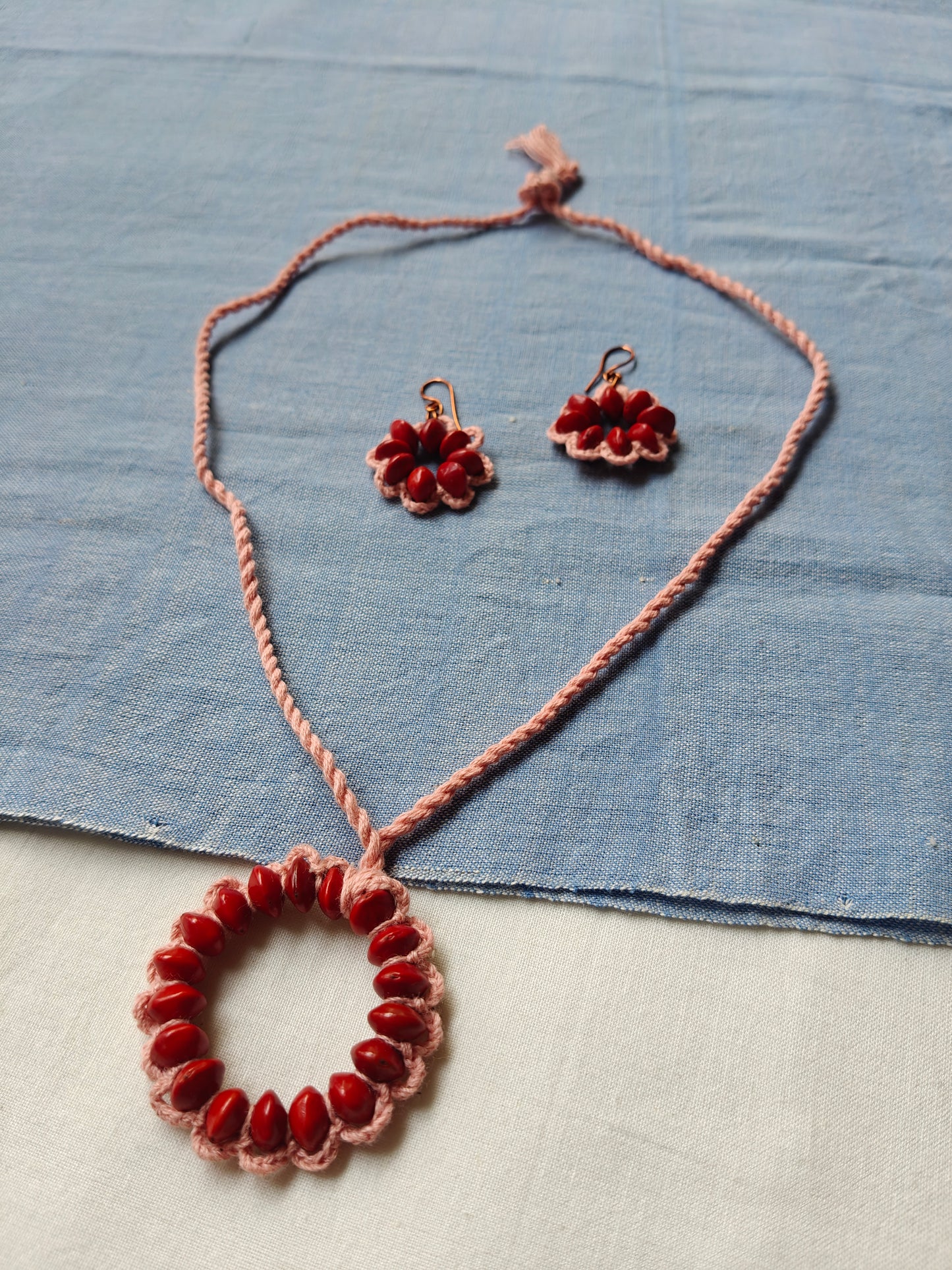 Red Circle seeds in pink yarn Neck piece and earrings set