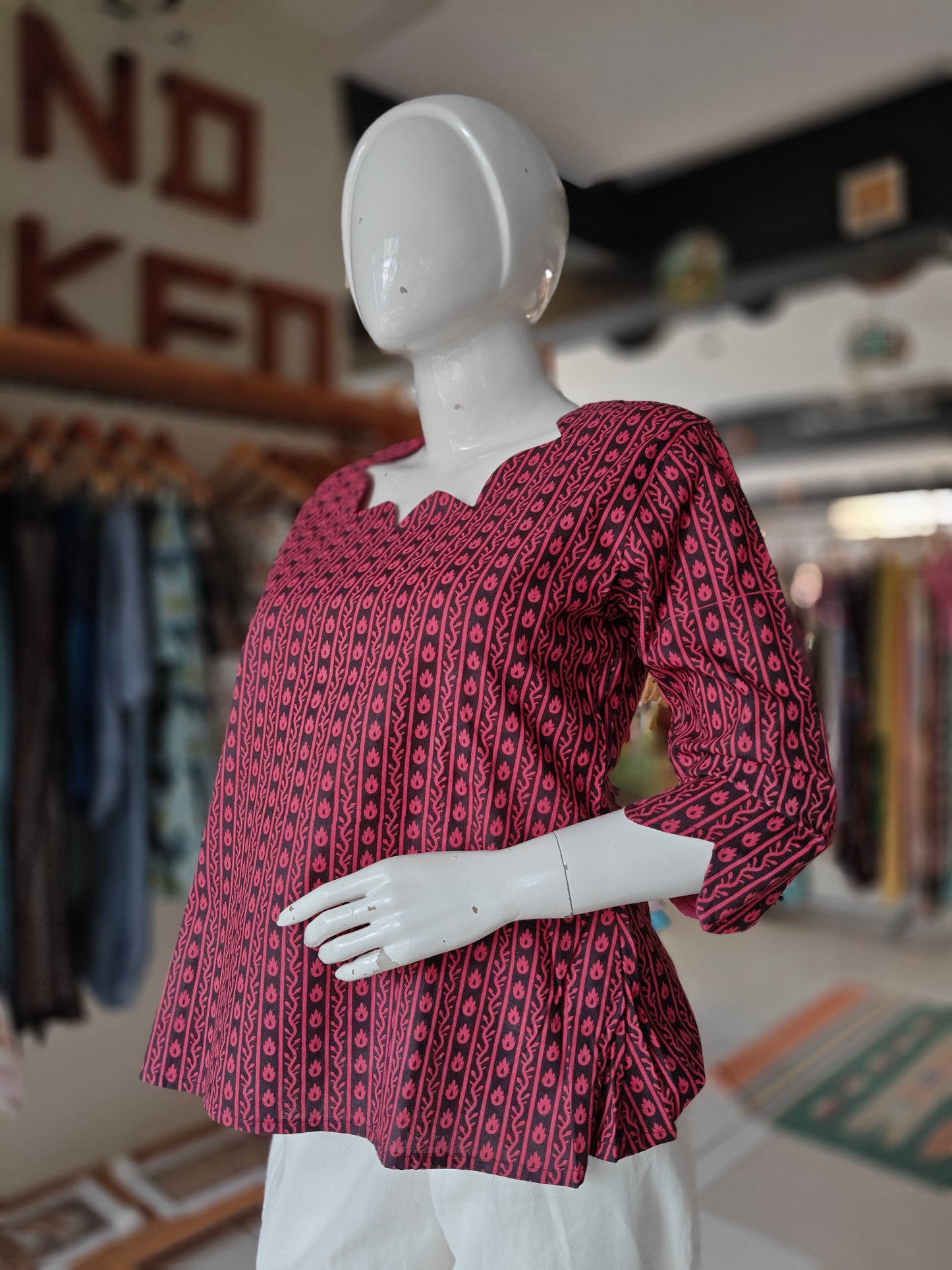 Pink and black hand block printed short kurti with fancy neckline