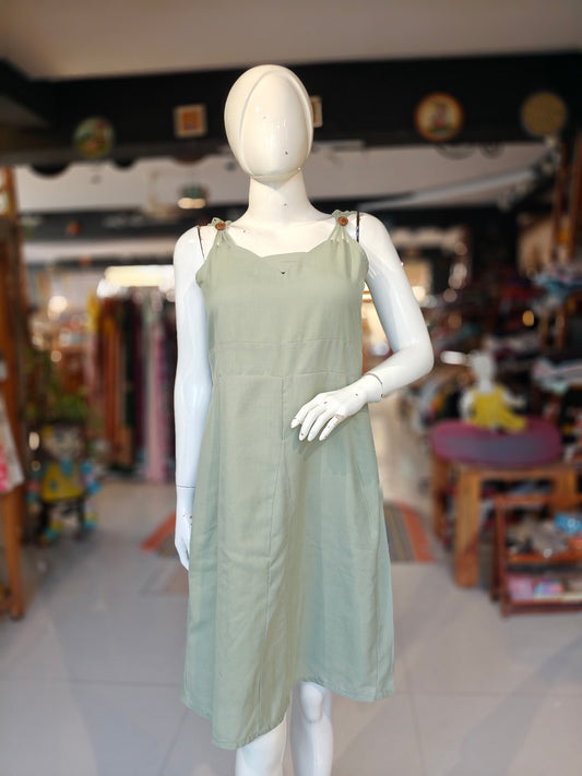 Pista green strappy dress with wooden buttons