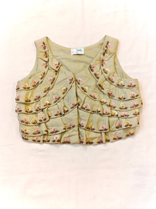 Pista green sleeveless blouse with hand embroidered floral motifs