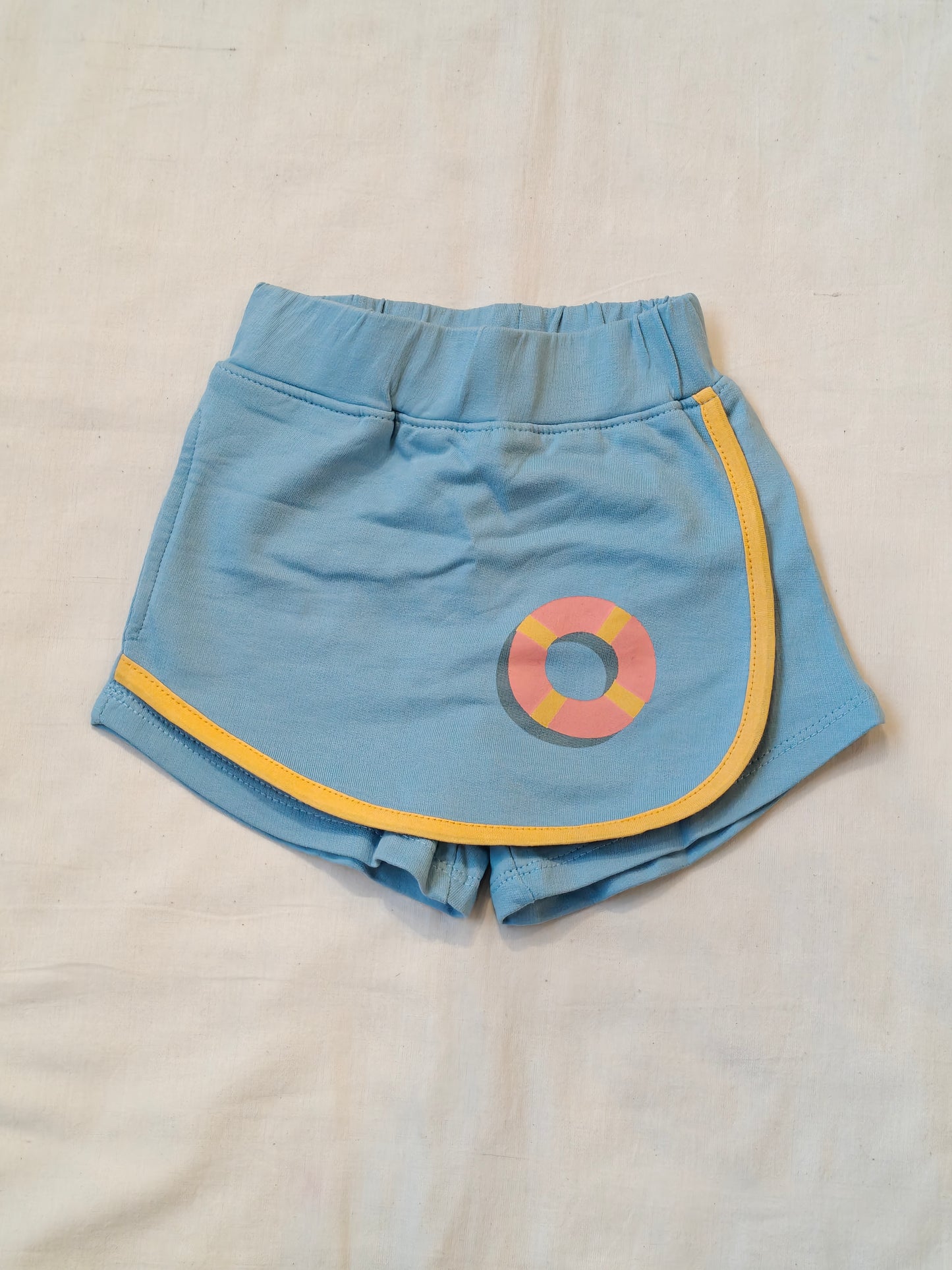 Blue flap style skirt look shorts with a tube print for children