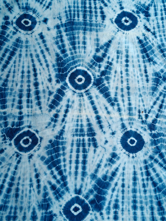 Blue and white tie and dye sun burst pattern fabric