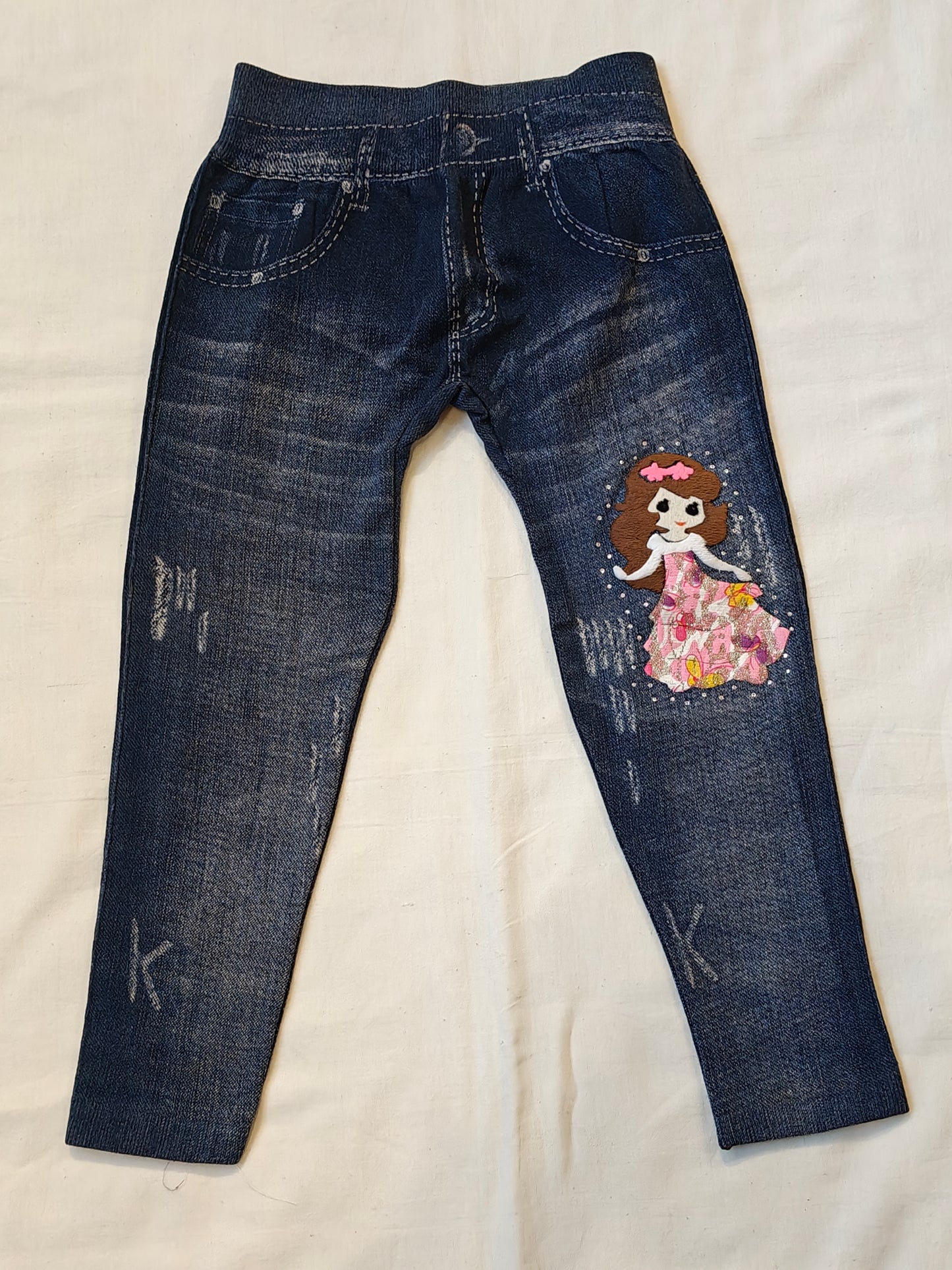 Dark blue jeggings with embroidered doll