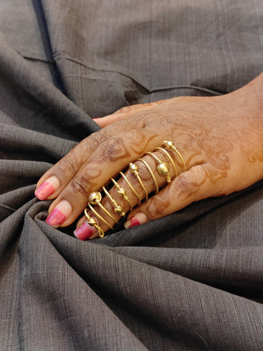 Long spiral finger ring with beads -  hand made in brass