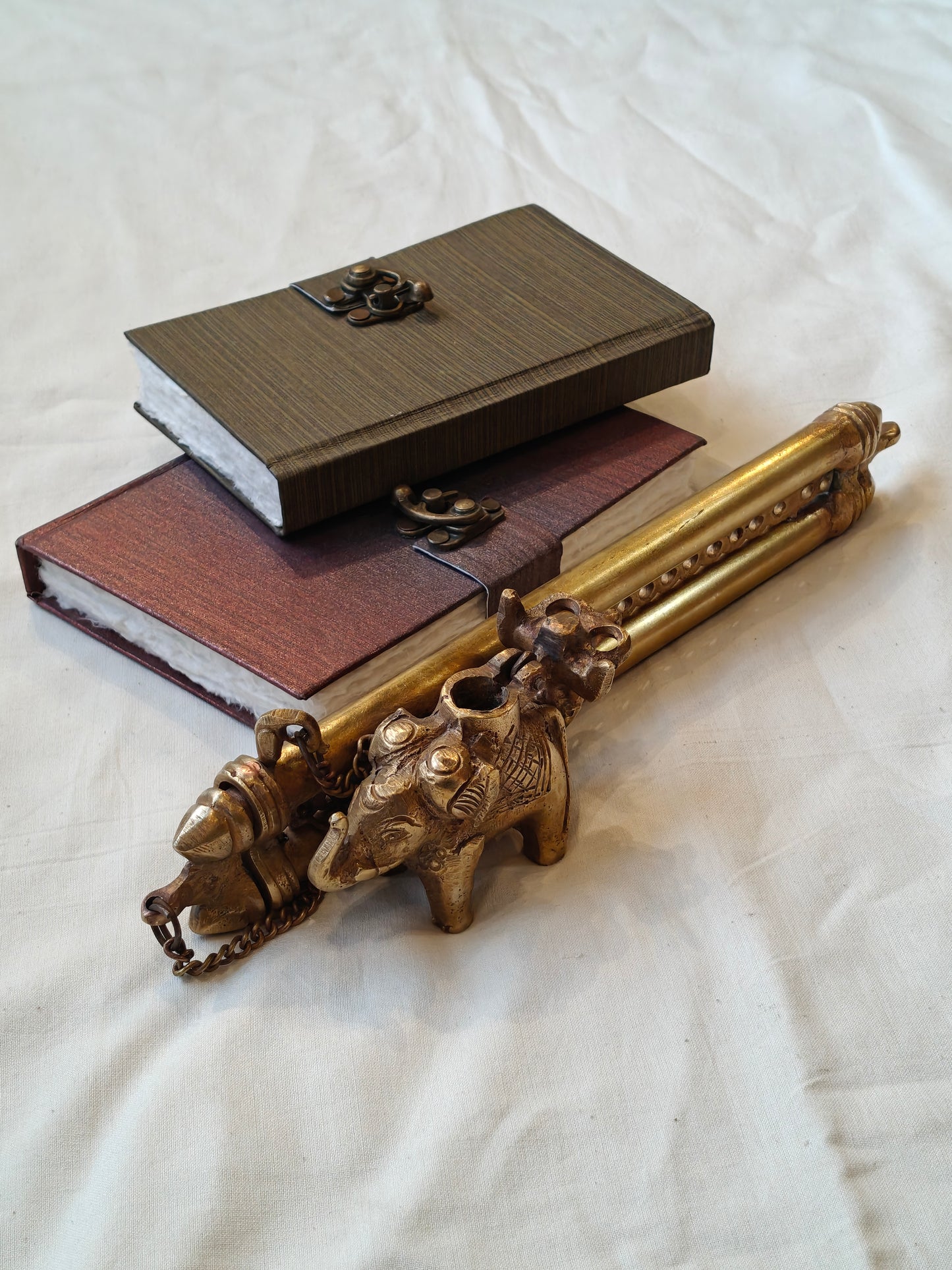 Vintage brass handcrafted ink pot with a person riding on an elephant design, double pen / quill holder with lock