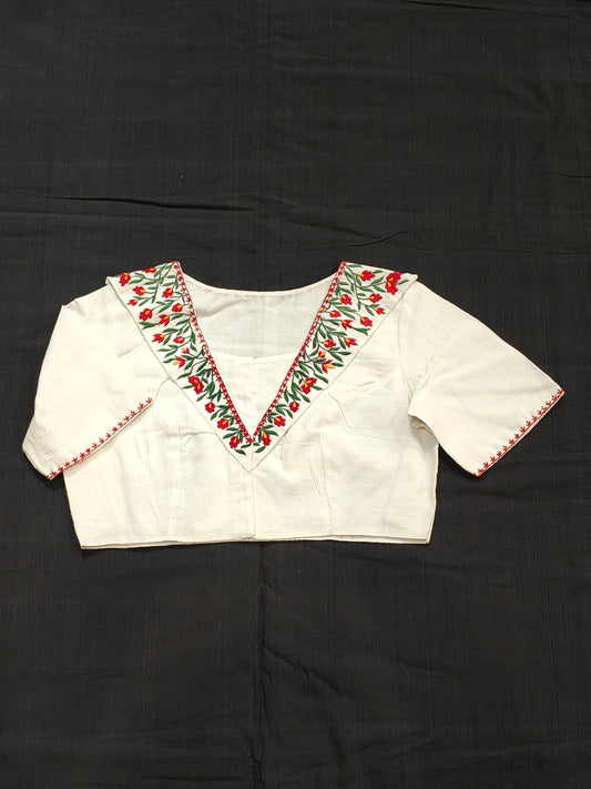 White blouse with red floral embroidery on dummy collar and sleeves - front open