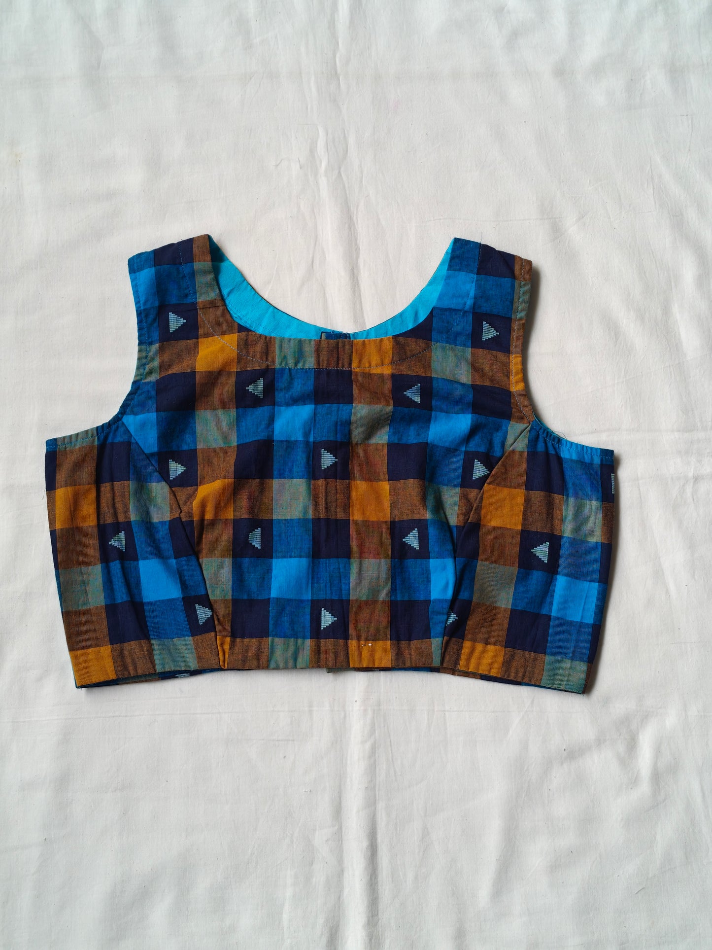 Blue and orange checkered pattern with triangular motifs cotton blouse