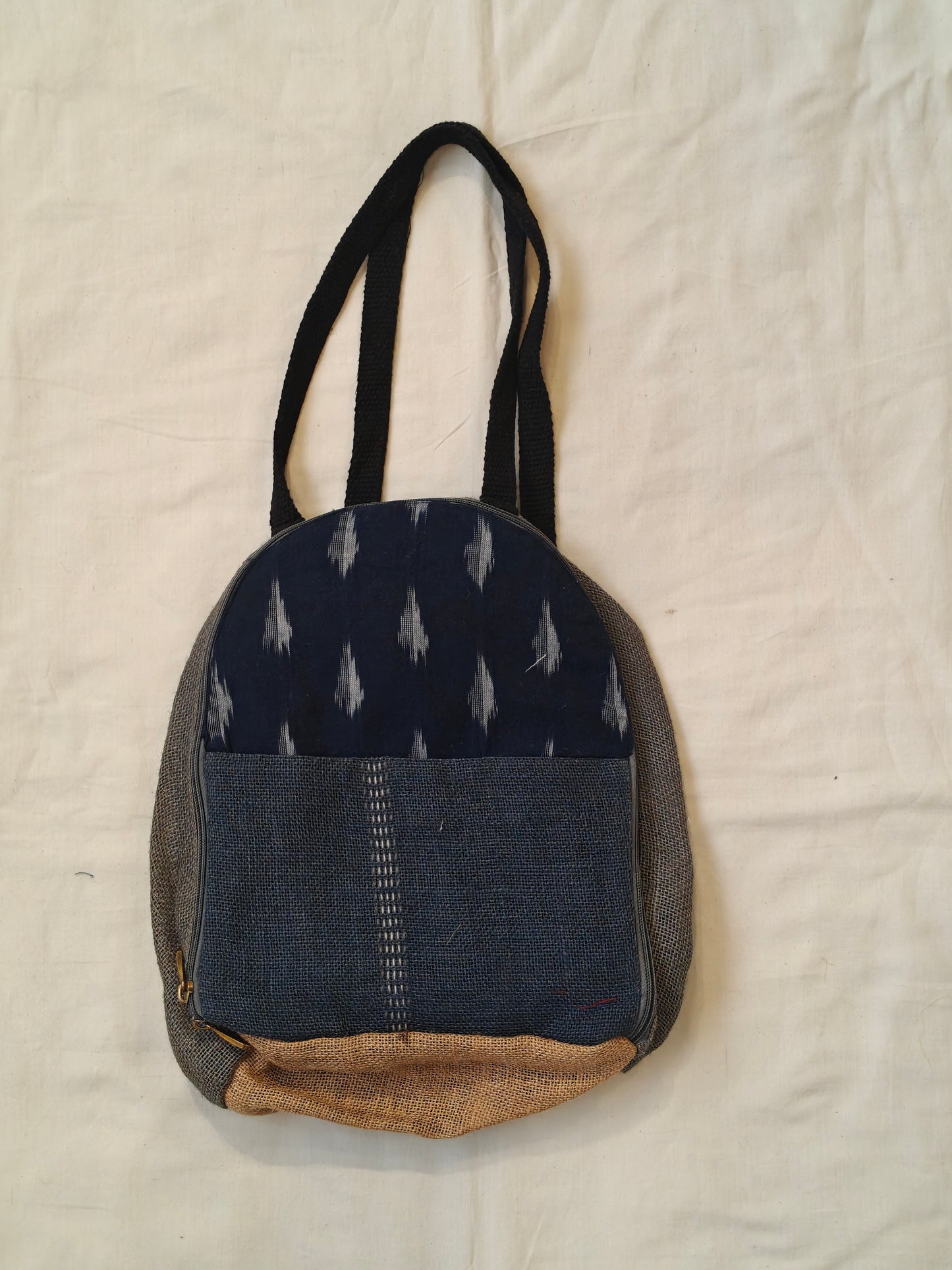Day back pack cum handbag in jute with fabric panel