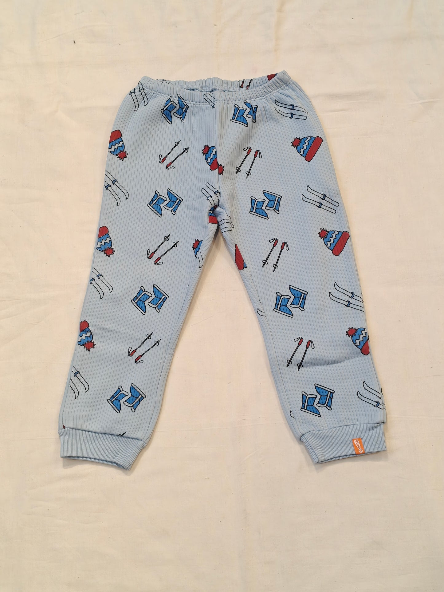 Blue thermal pants for kids with skiing tools prints