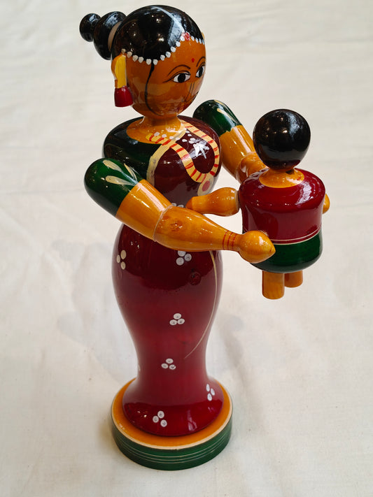 Mother tossing baby - handcrafted wooden decor