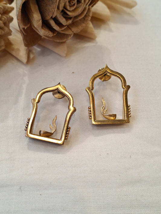 Jharokha frame enclosing burning diya design brass stud earrings