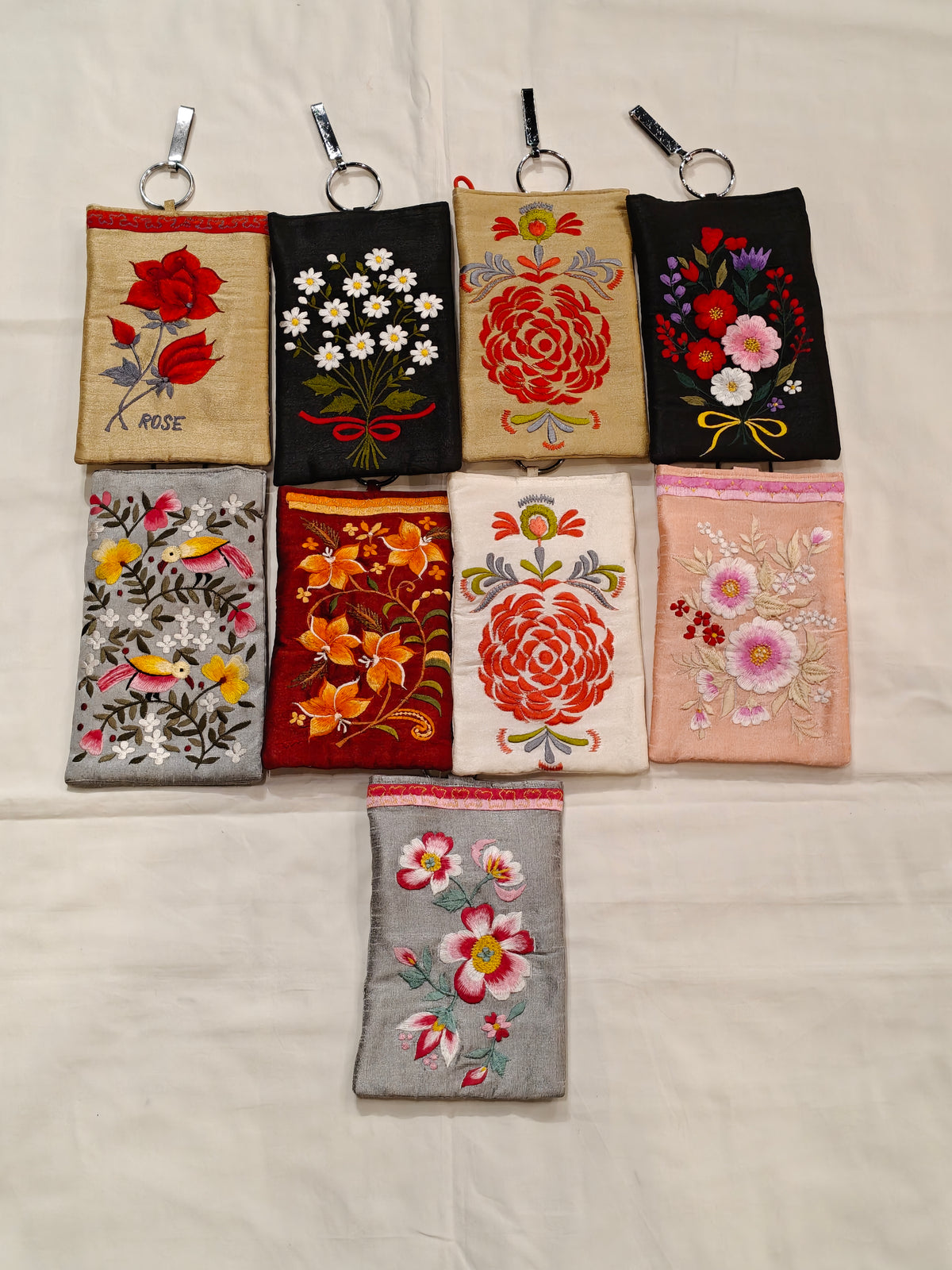 Silk embroidered phone pouches with waist clip on and a sling - multiple options available