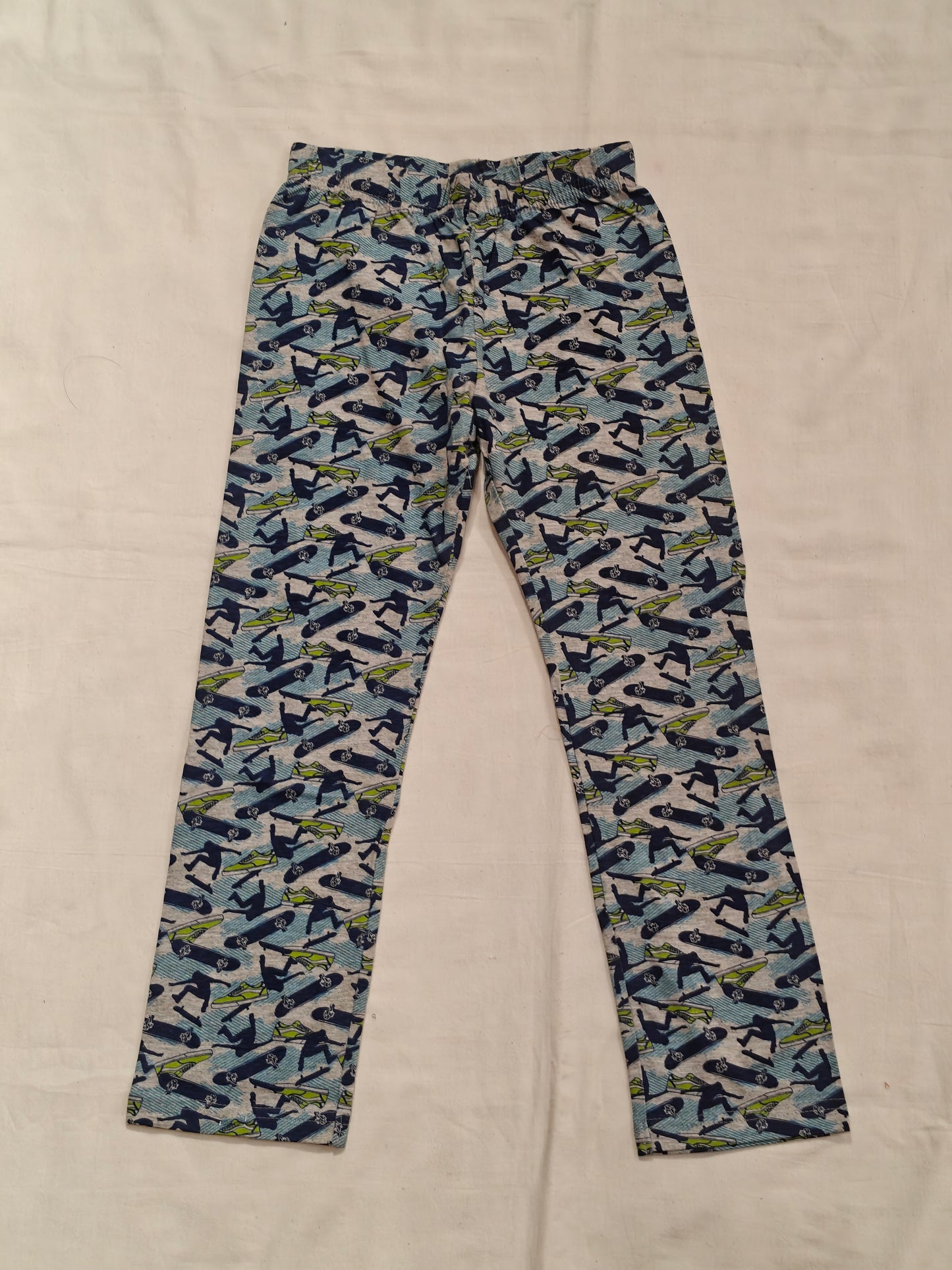 Blue pyjama pants with skateboard prints for children