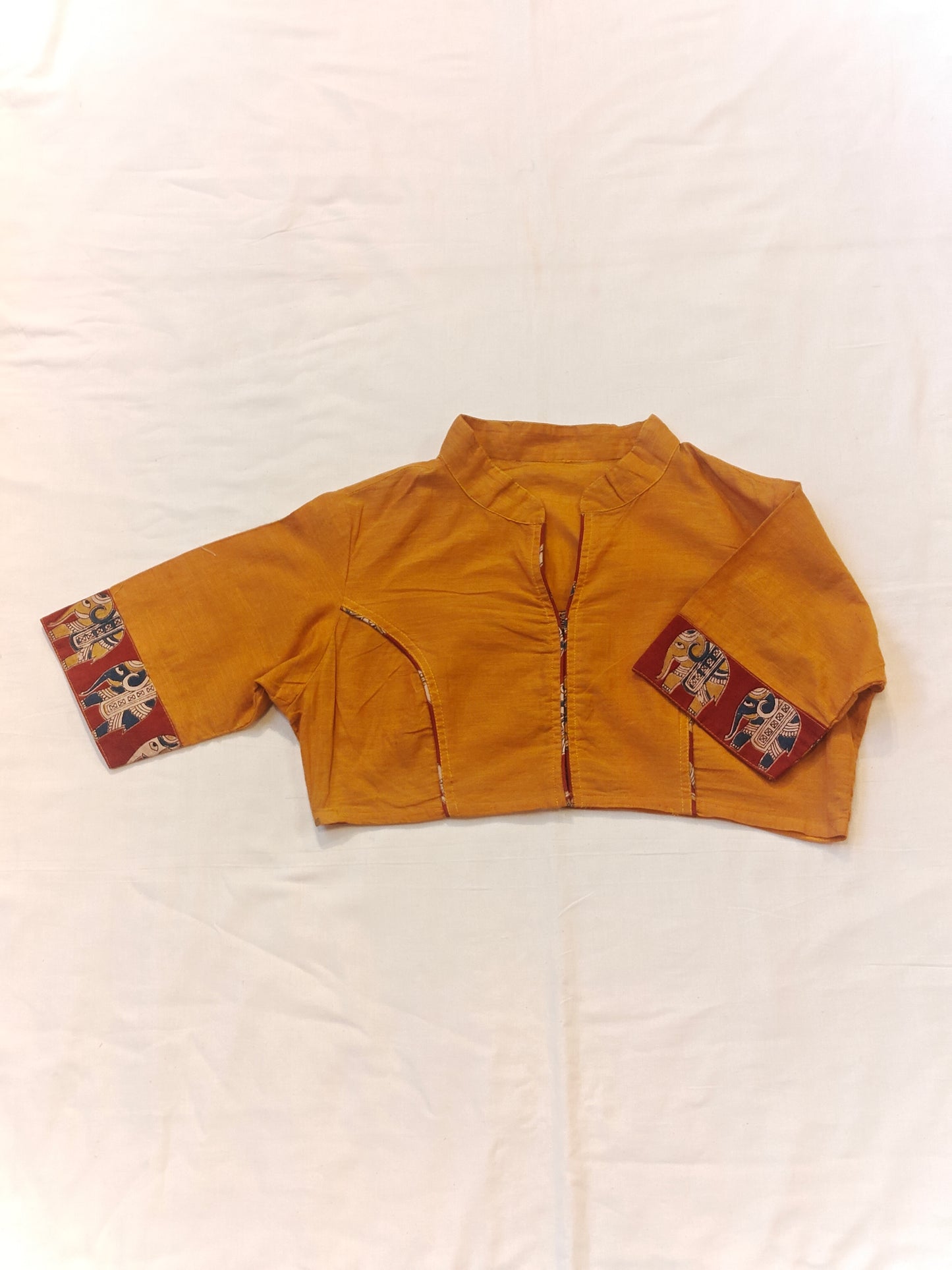 Orange collared cotton short blouse with elephant motif borders