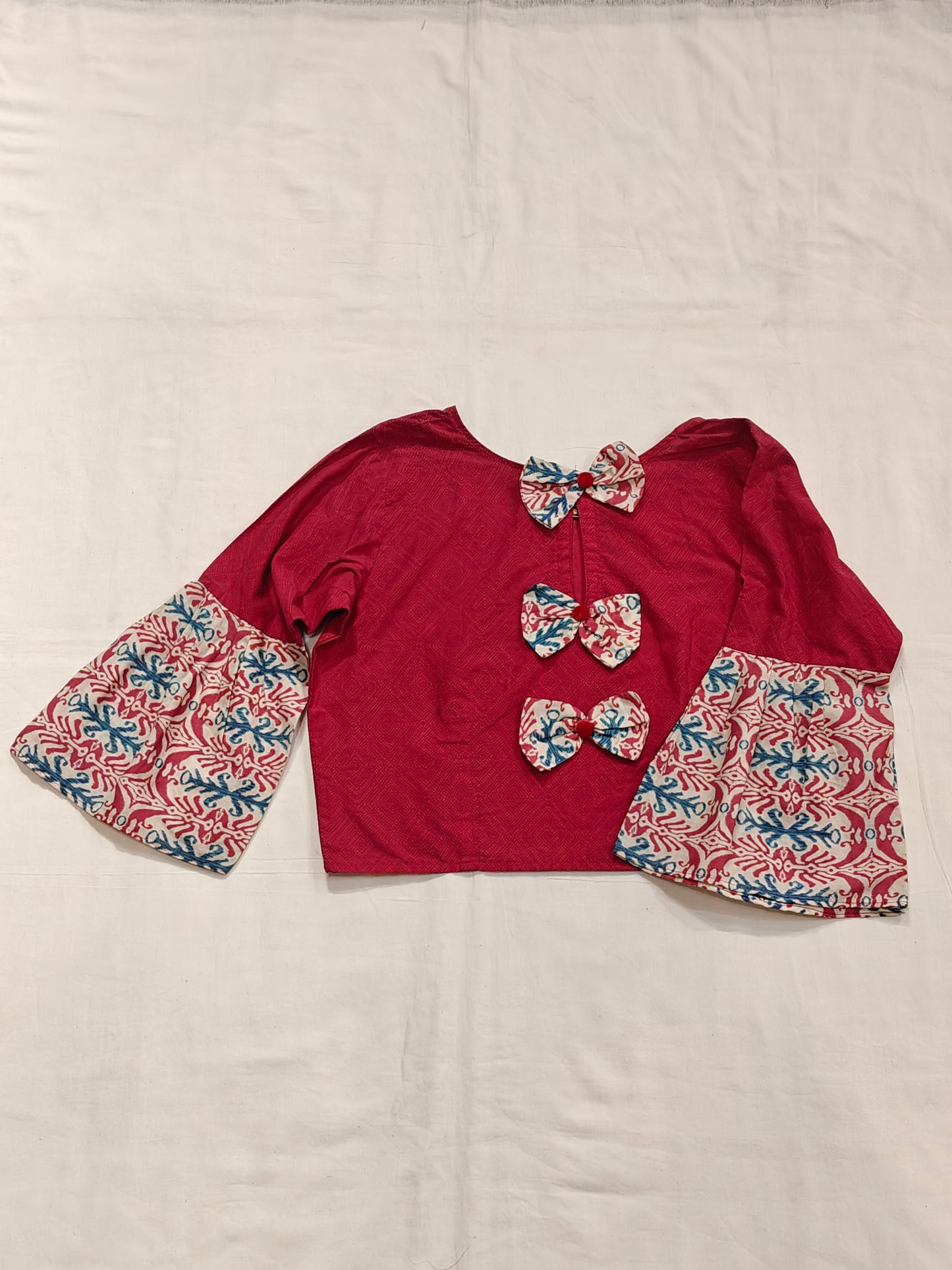 Pink printed flared sleeves cotton blouse with bows