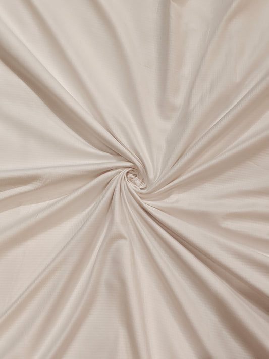 Plain white textured cotton fabric