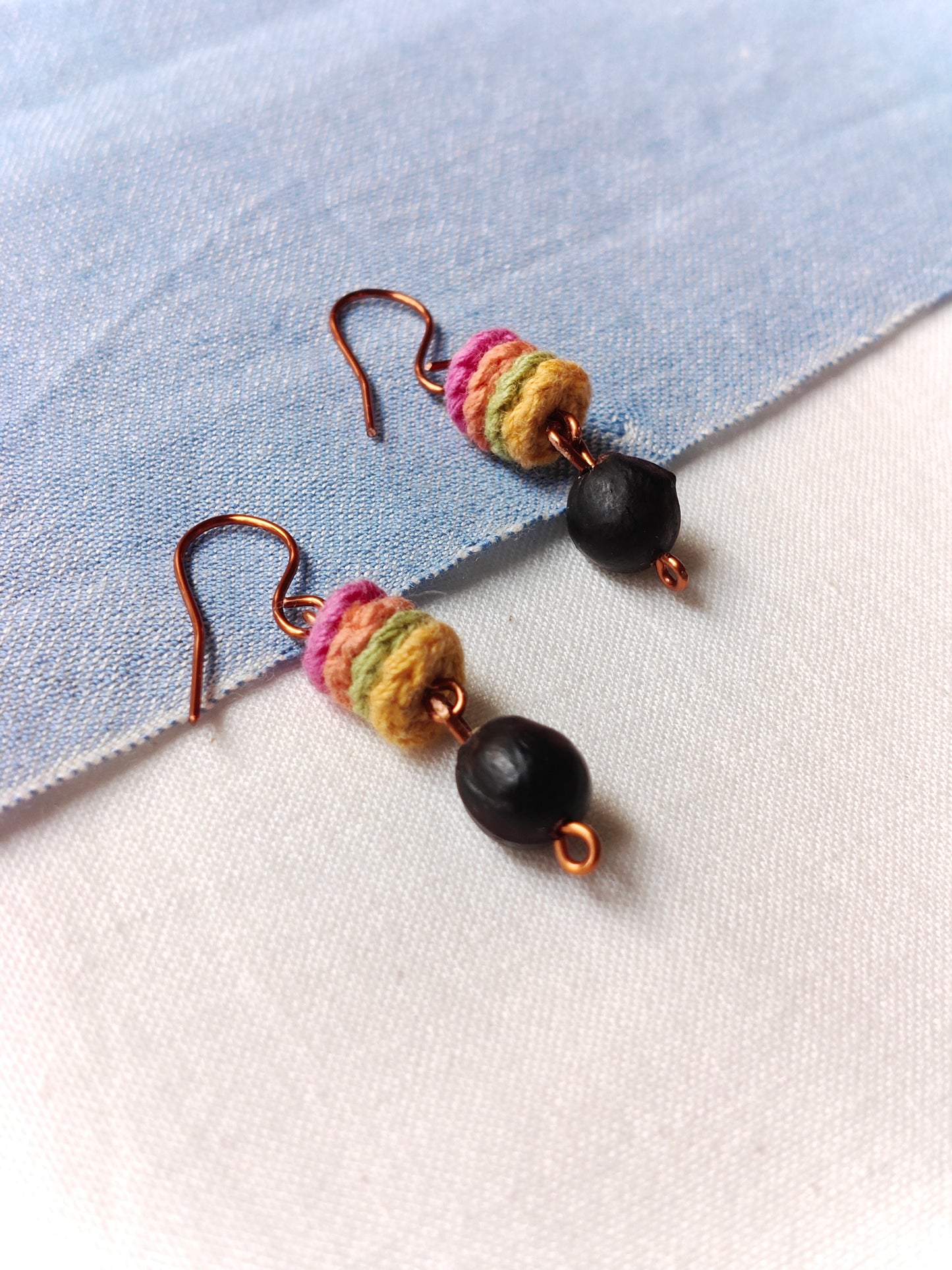 Handcrafted earrings with seeds and crochet flowers