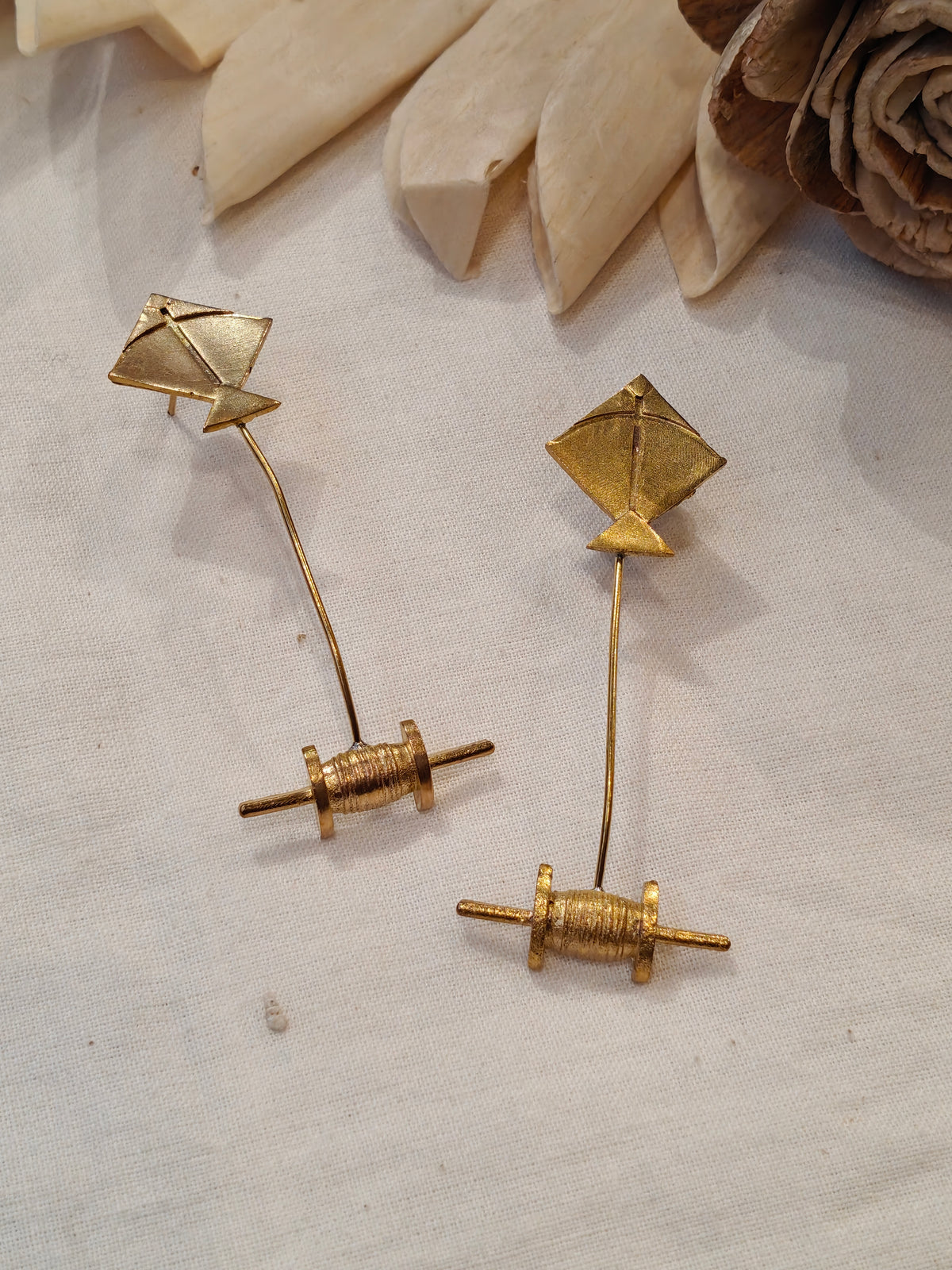 Kite and spool shaped brass earrings