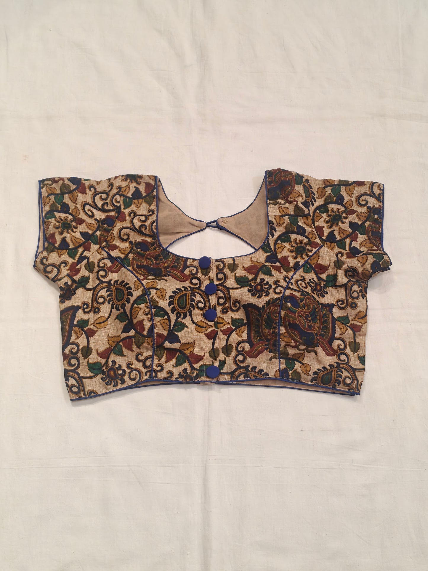 Kalamkari prints with peacock on cream base silk blouse