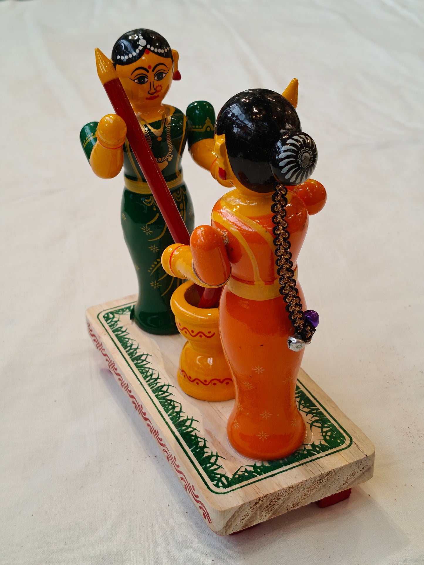 Two women pounding - handcrafted wooden decor