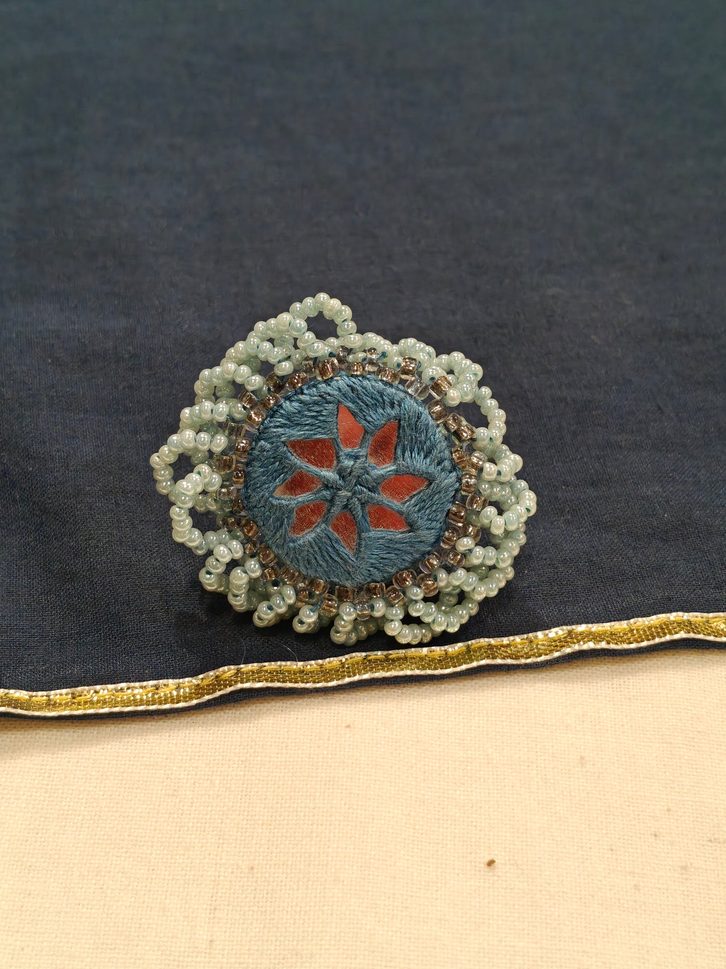 Handcrafted finger ring with bead work and mirror