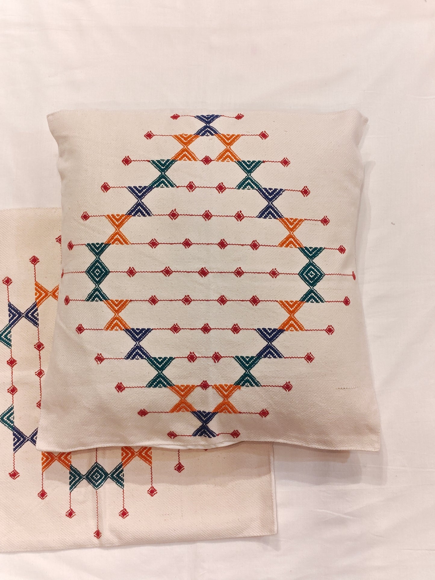 Off-white cotton cushion covers with pattu handwoven design