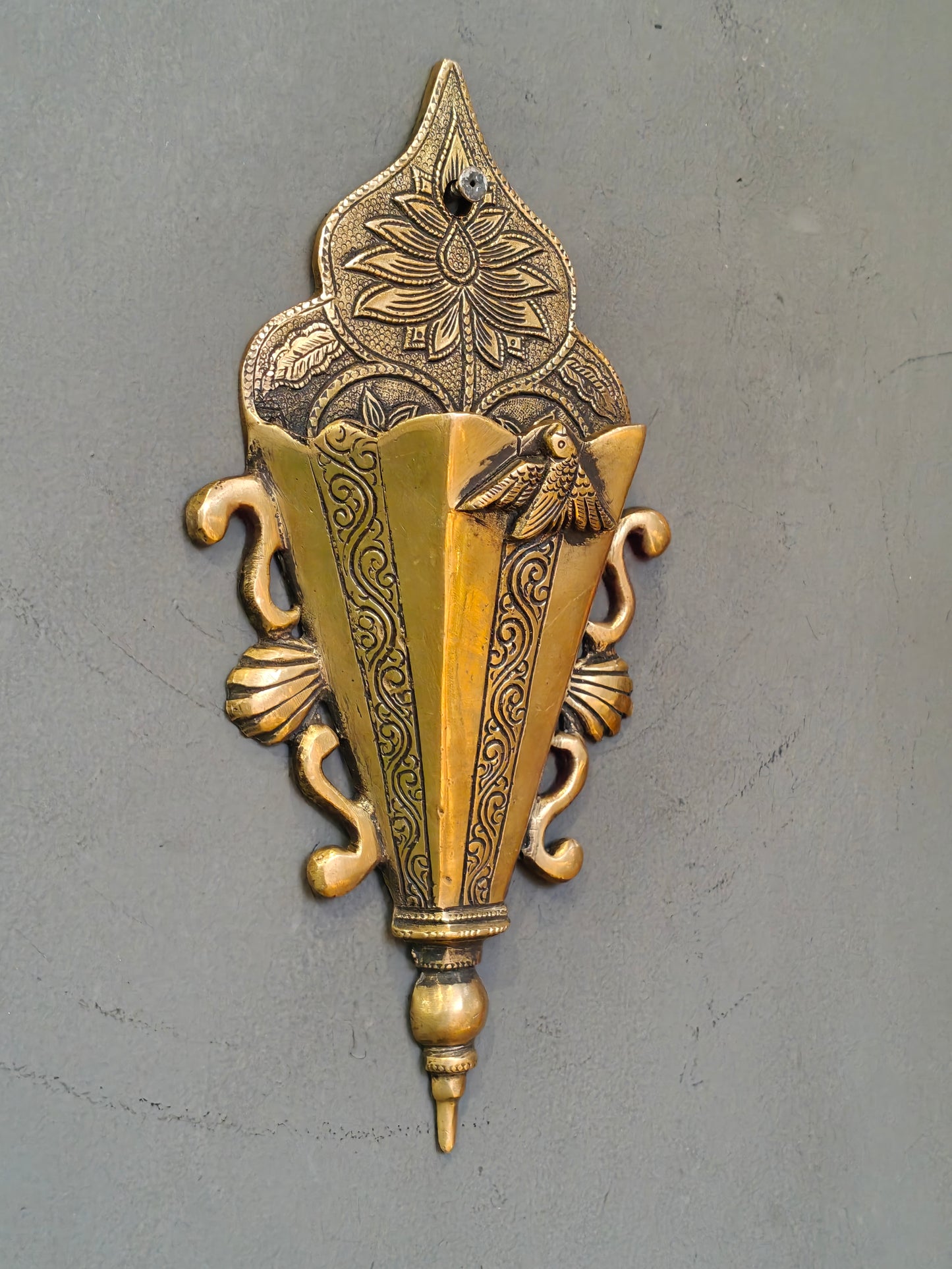 Brass wall pocket featuring intricate traditional engravings - wall decor cum organizer