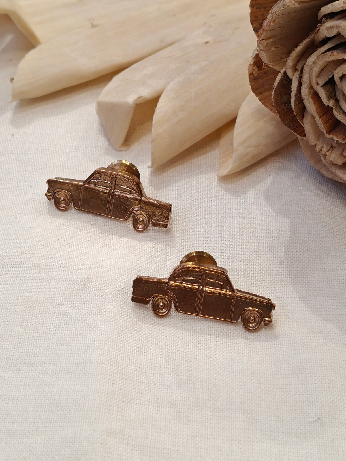 Car shaped brass stud earrings