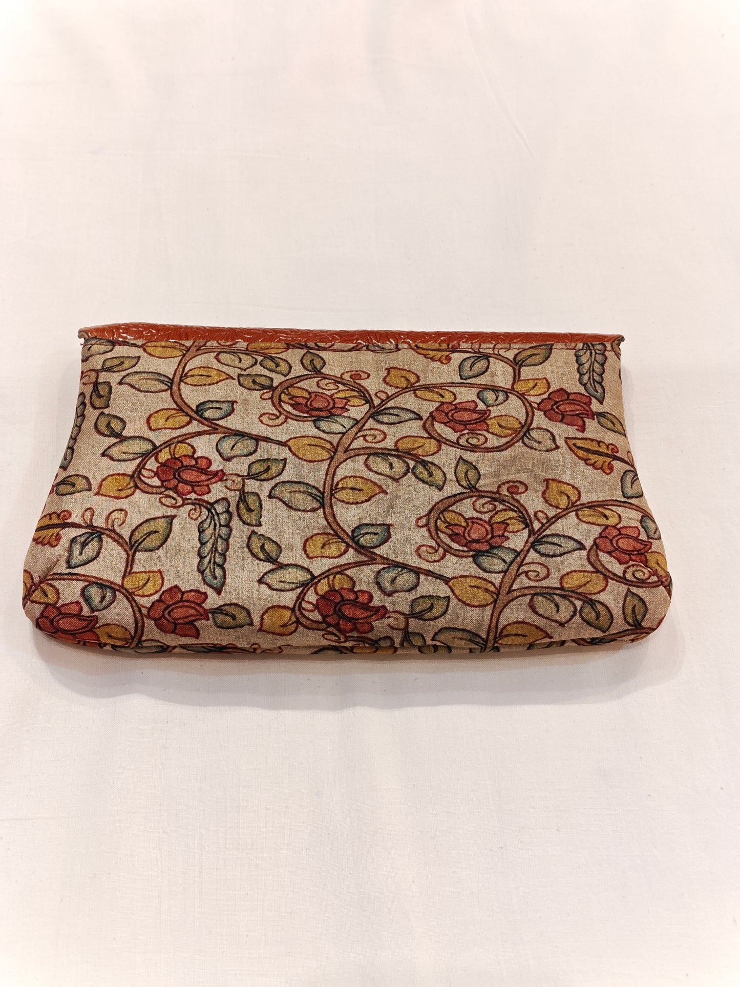 Leather hand embossed flap purse with hand block printed fabric base