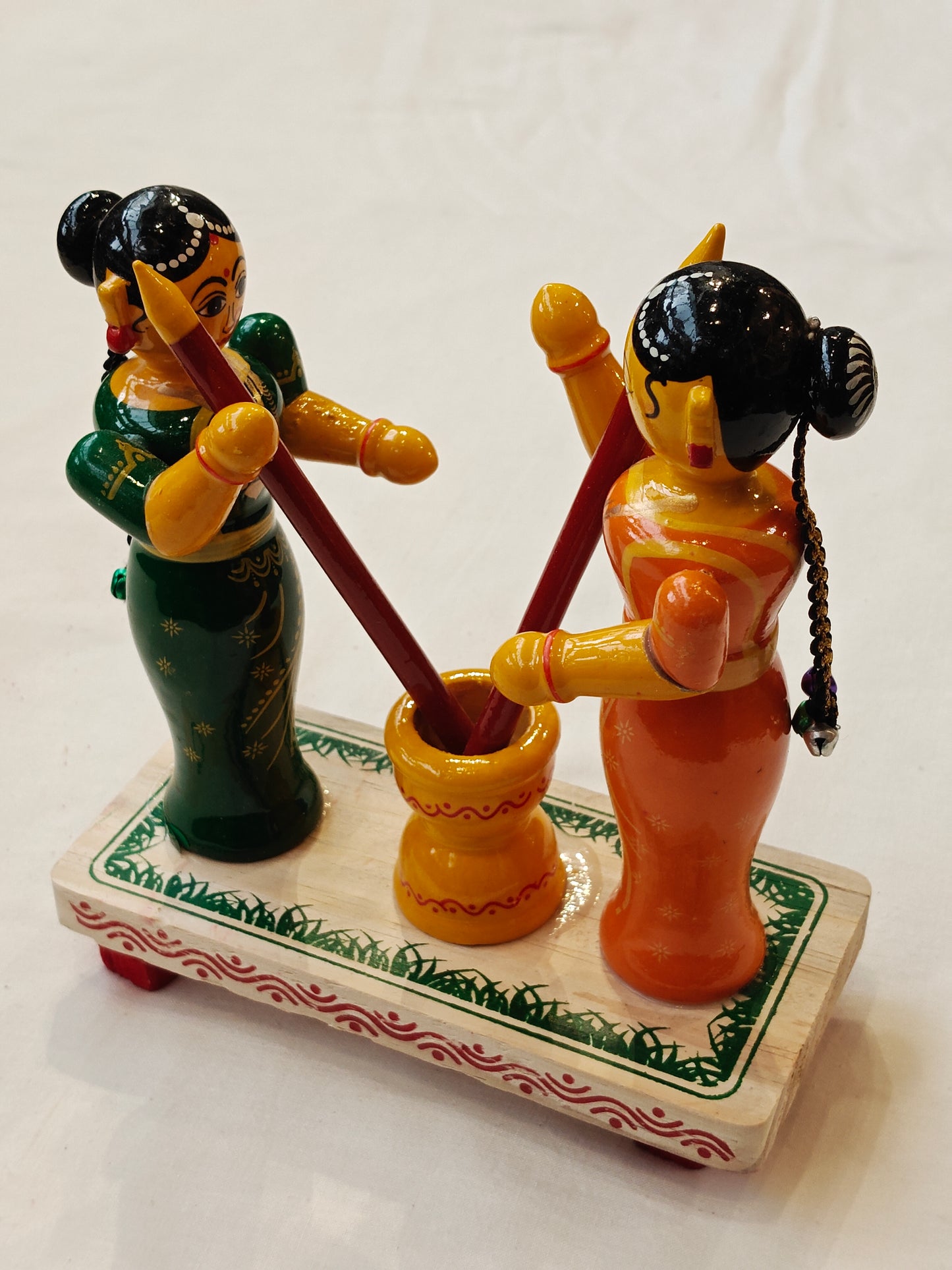 Two women pounding - handcrafted wooden decor