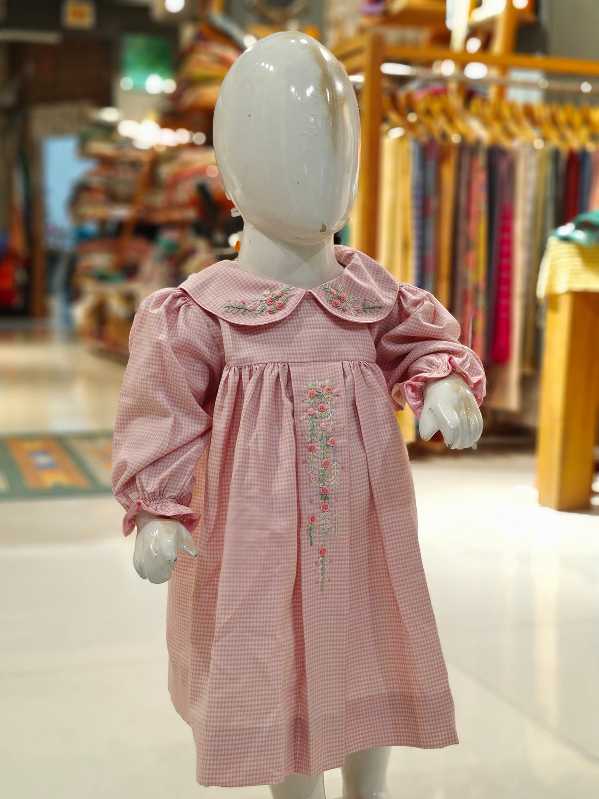 Pink checks smocking cotton frock with floral embroidery on peter pan collar and centre box pleat for girls