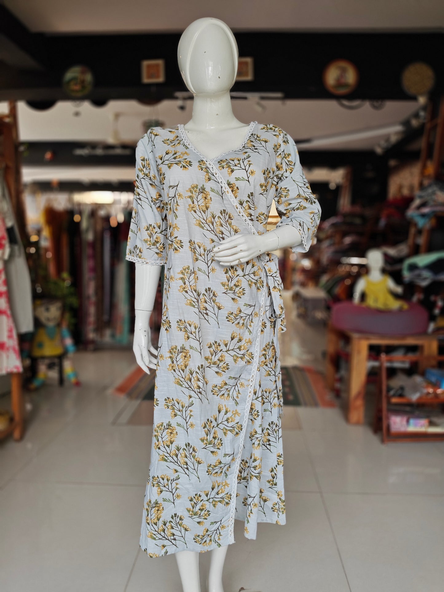 Greyish blue angrakha wrap dress with yellow floral prints and lace borders