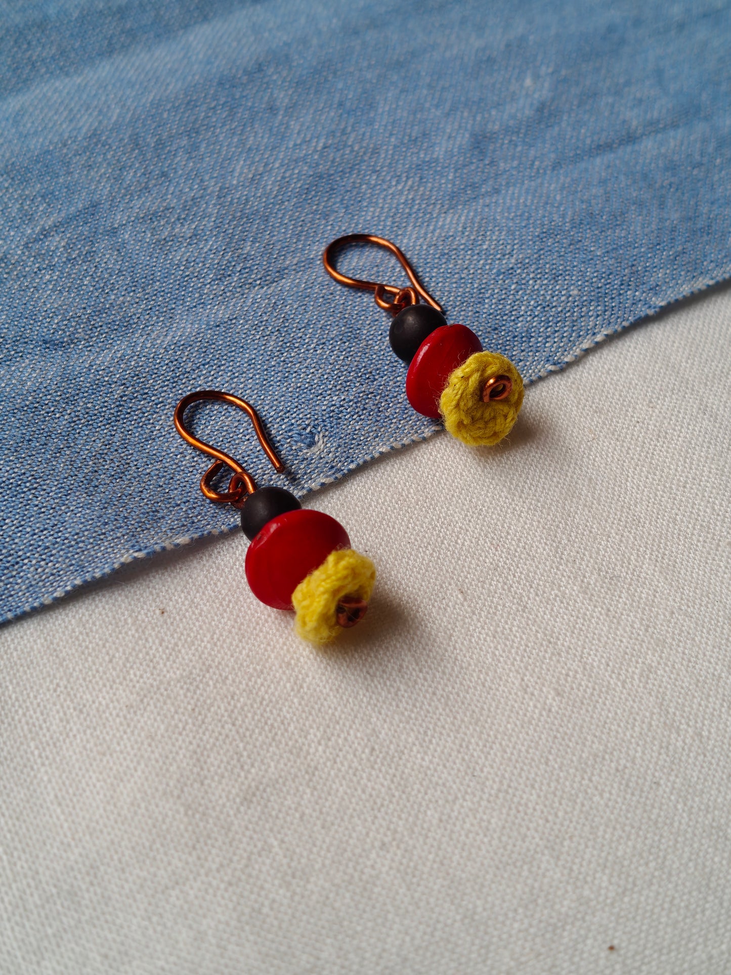 Handcrafted earrings with seeds and crochet flowers