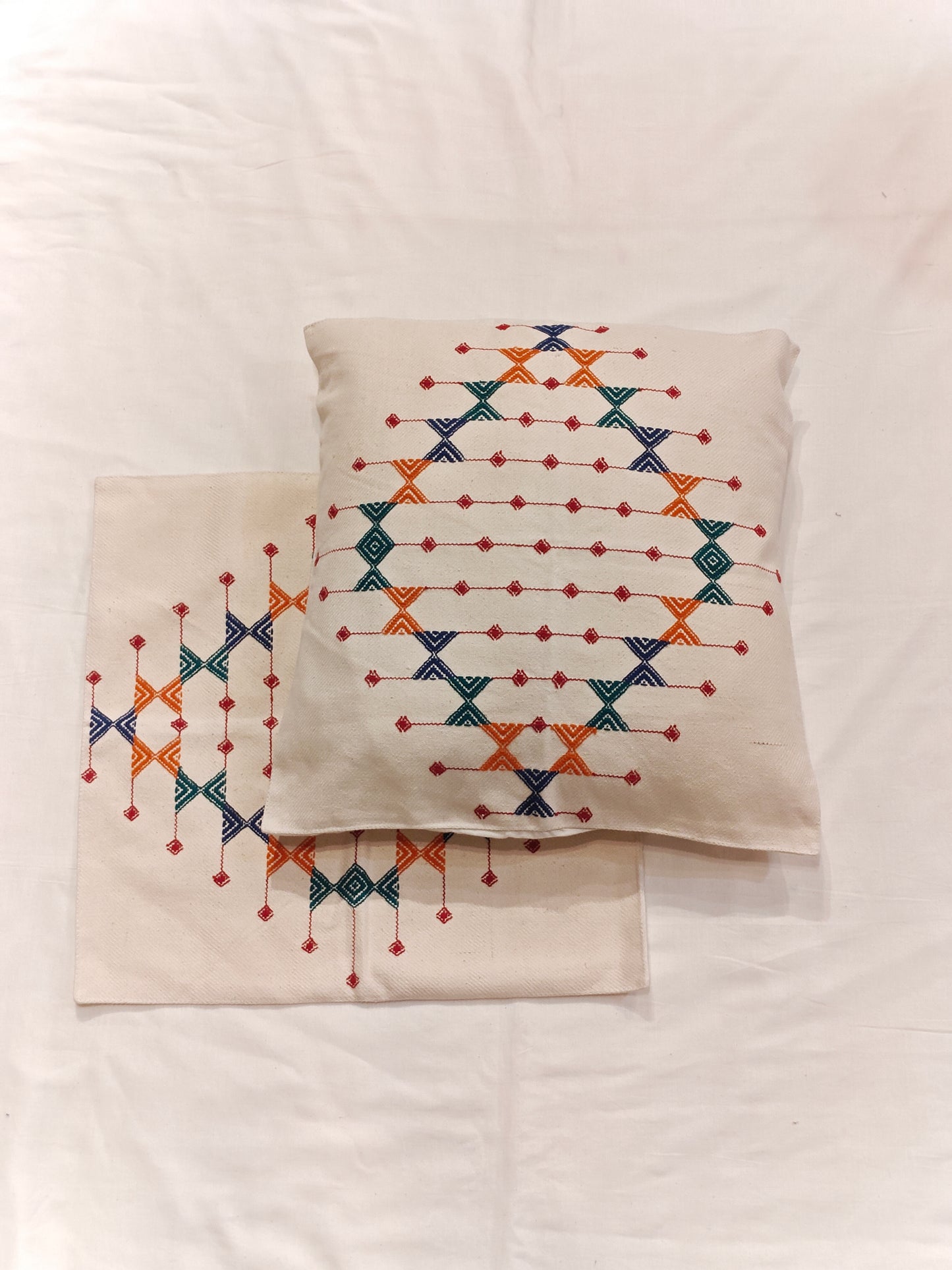 Off-white cotton cushion covers with pattu handwoven design