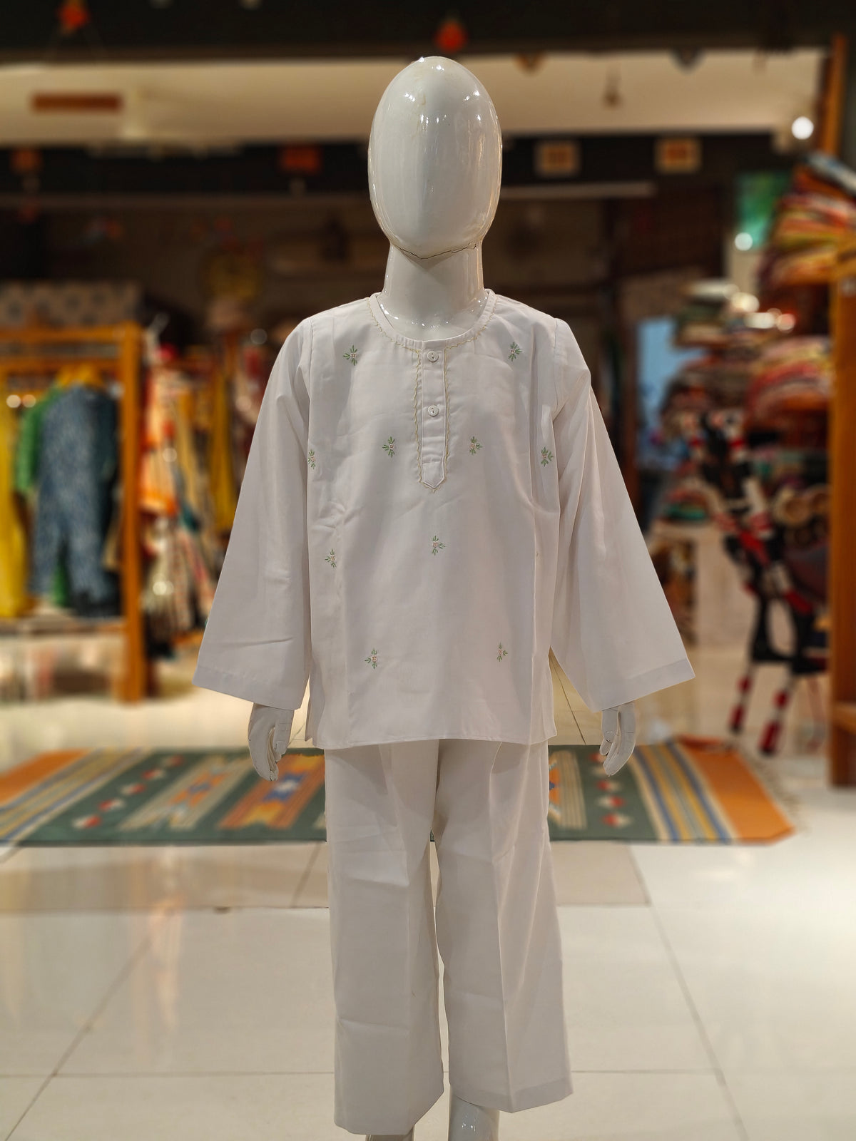 White long kurta pajama set with flower motifs for boys