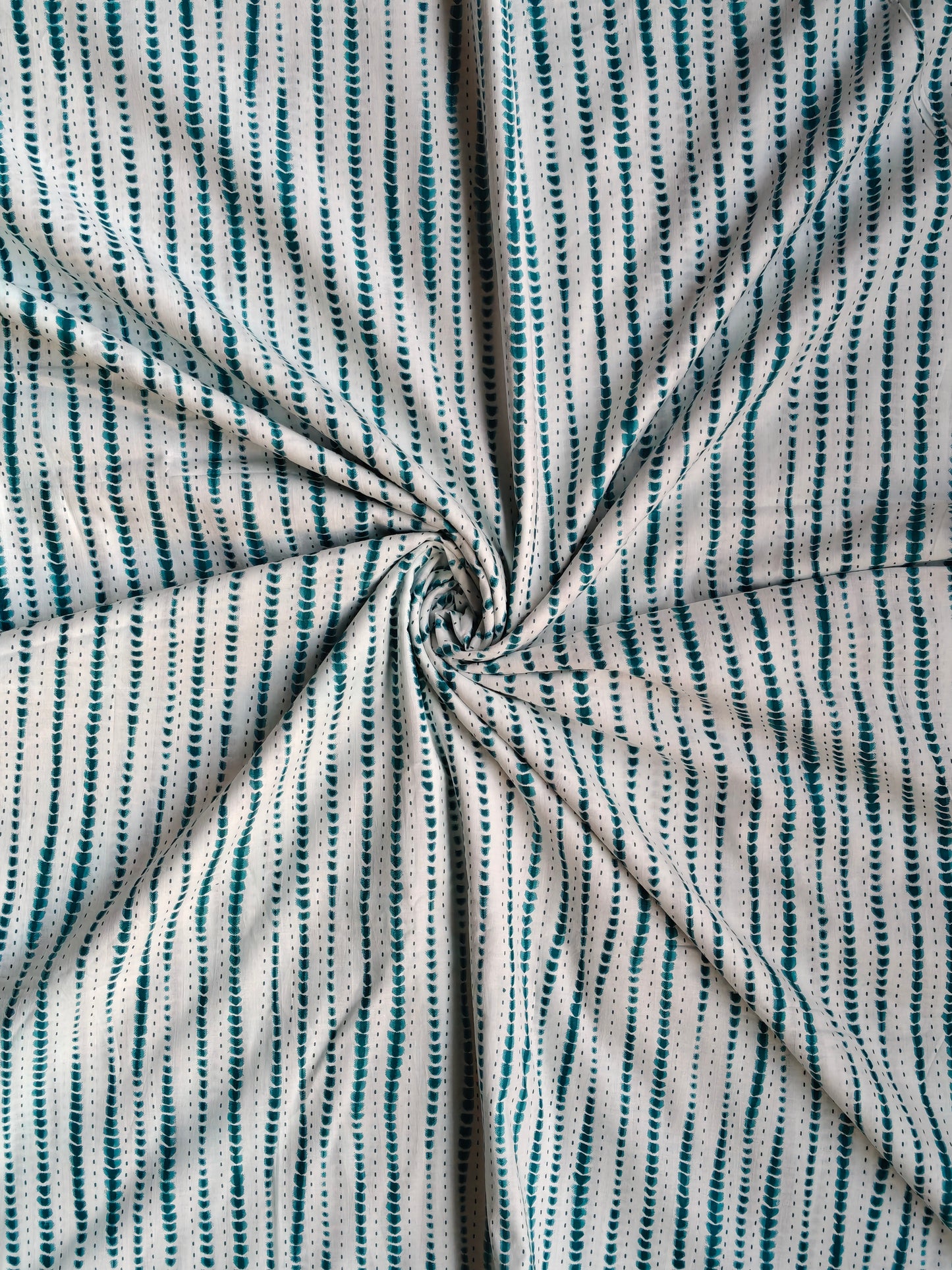 Green and white wavy stripes pattern fabric