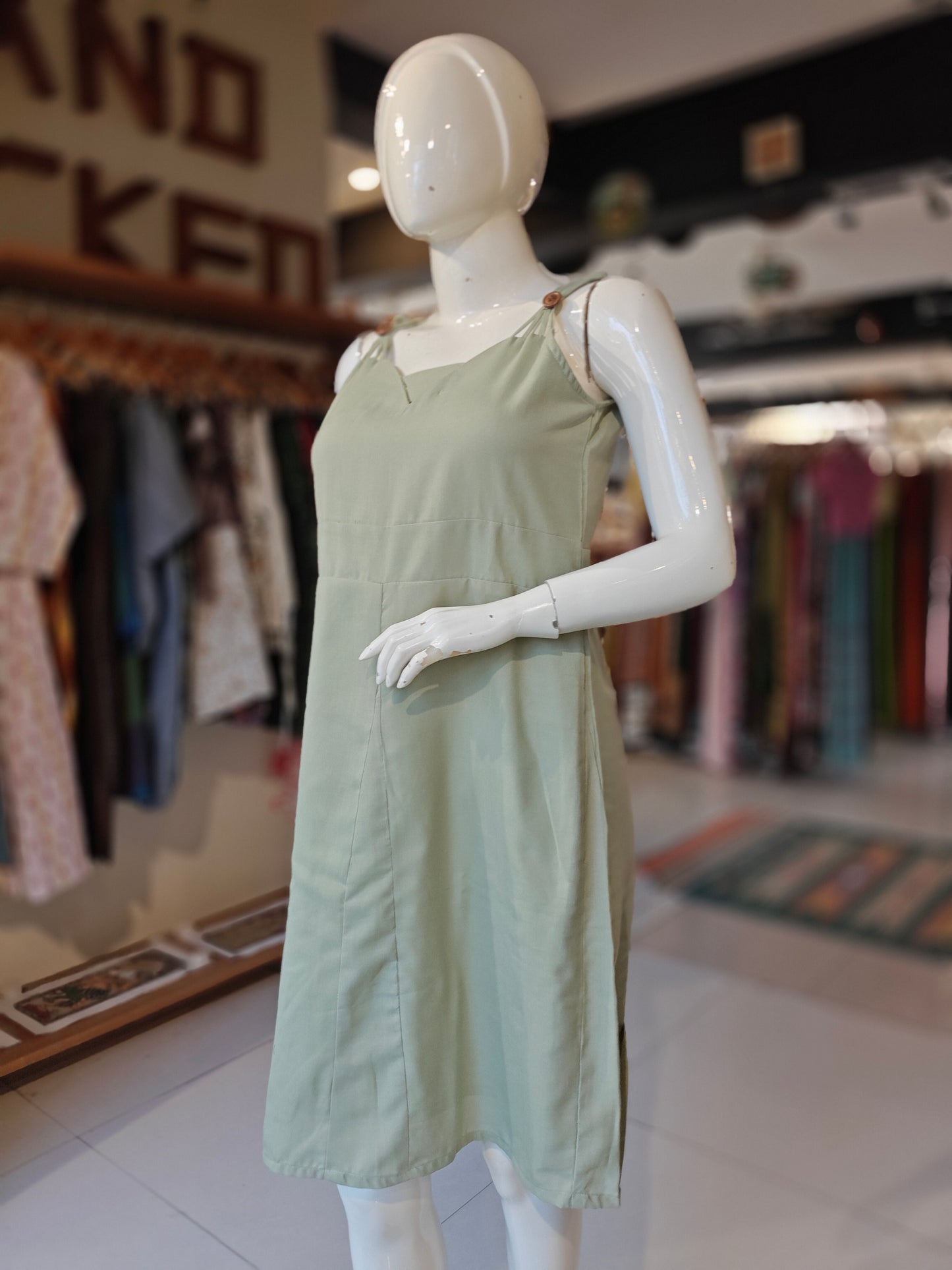 Pista green strappy dress with wooden buttons