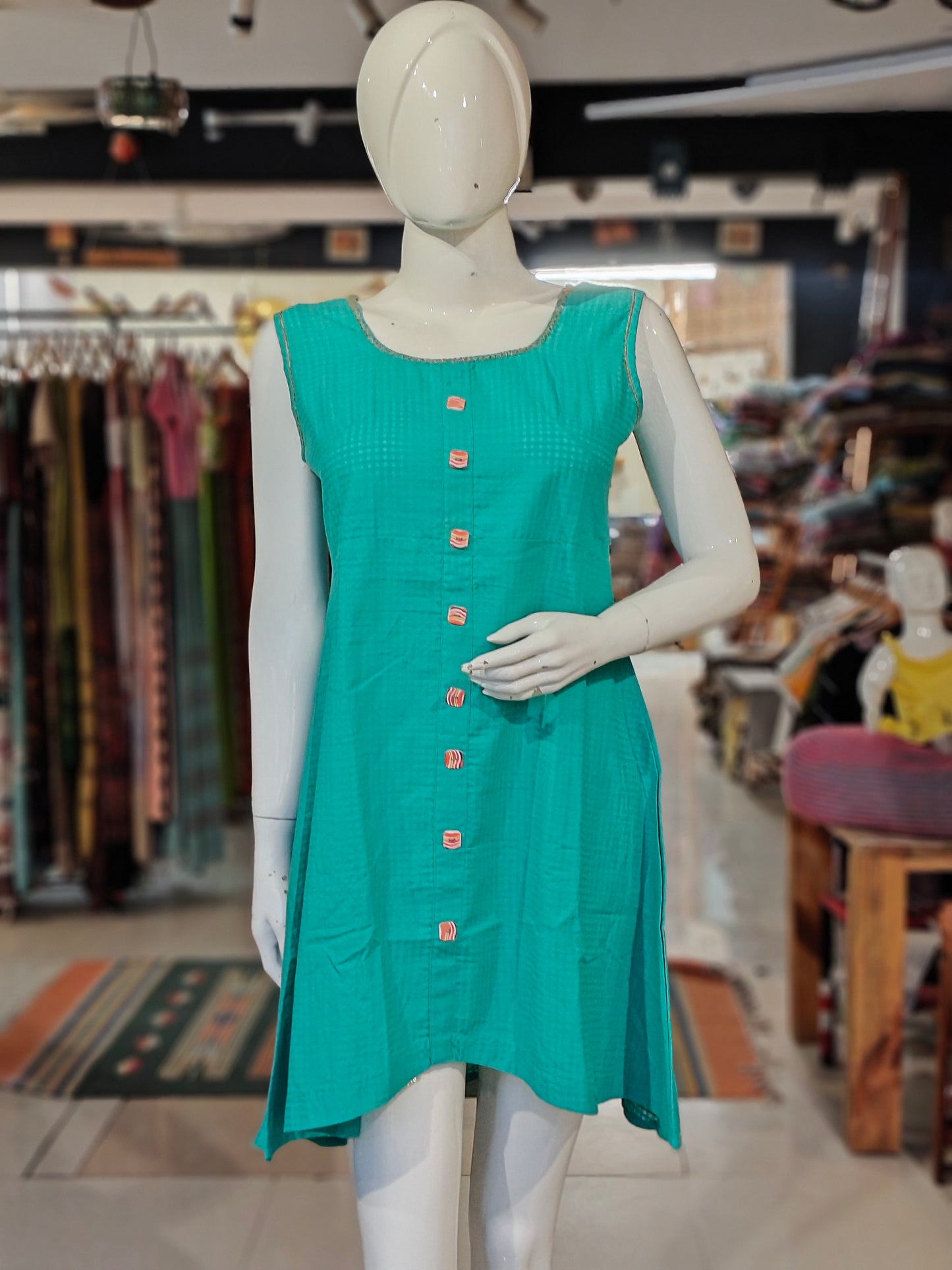 Teal green sleeveless cotton dress with embroidery on neckline n sleeves cap